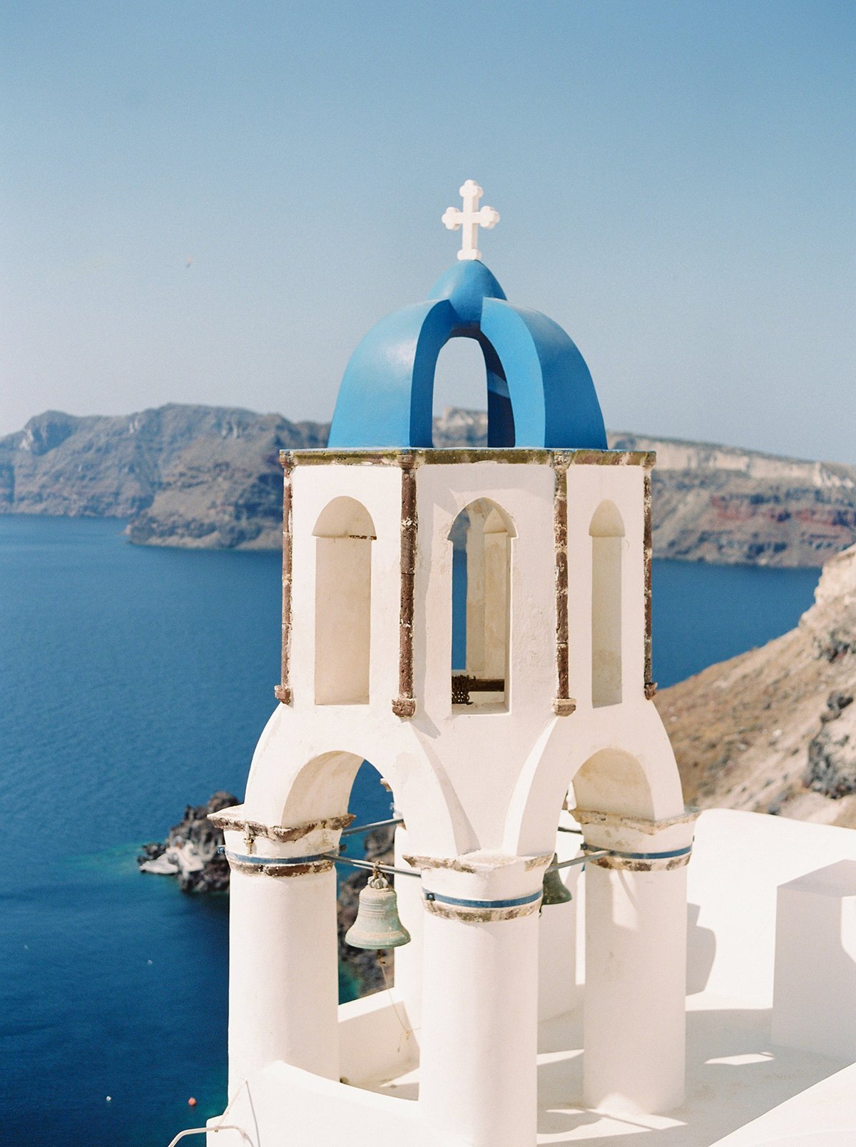 Whitewashed Santorini buildings overlooking the Aegean Sea