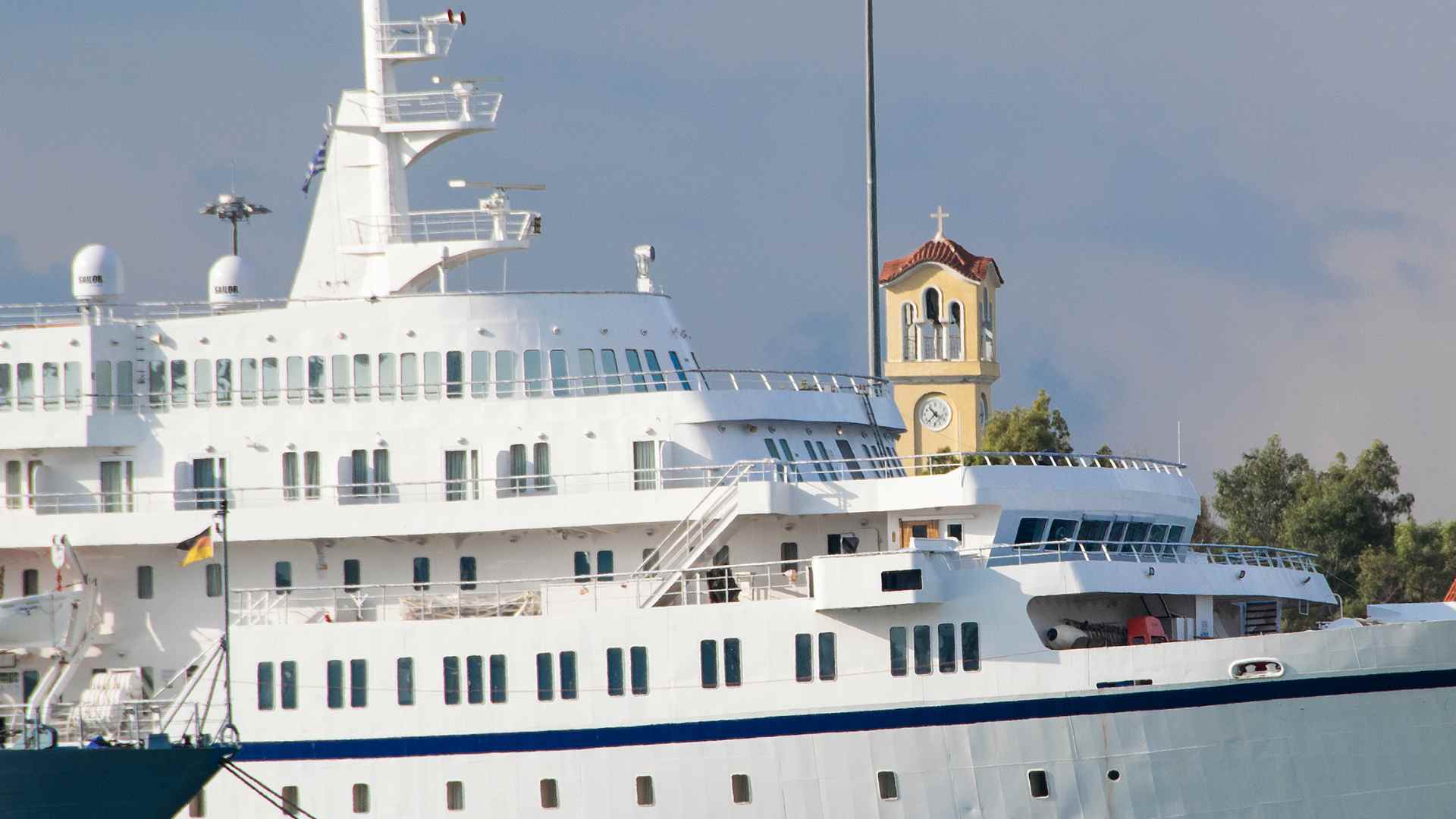 Passenger ferry and church tower at the port of Piraeus