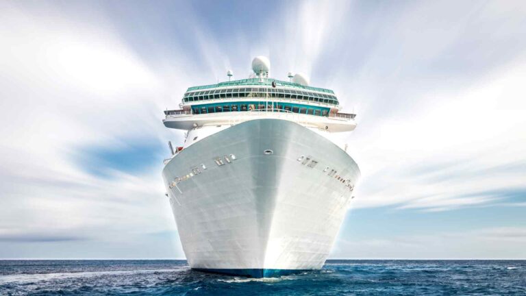 Cruise ship photographed head-on while sailing through open water