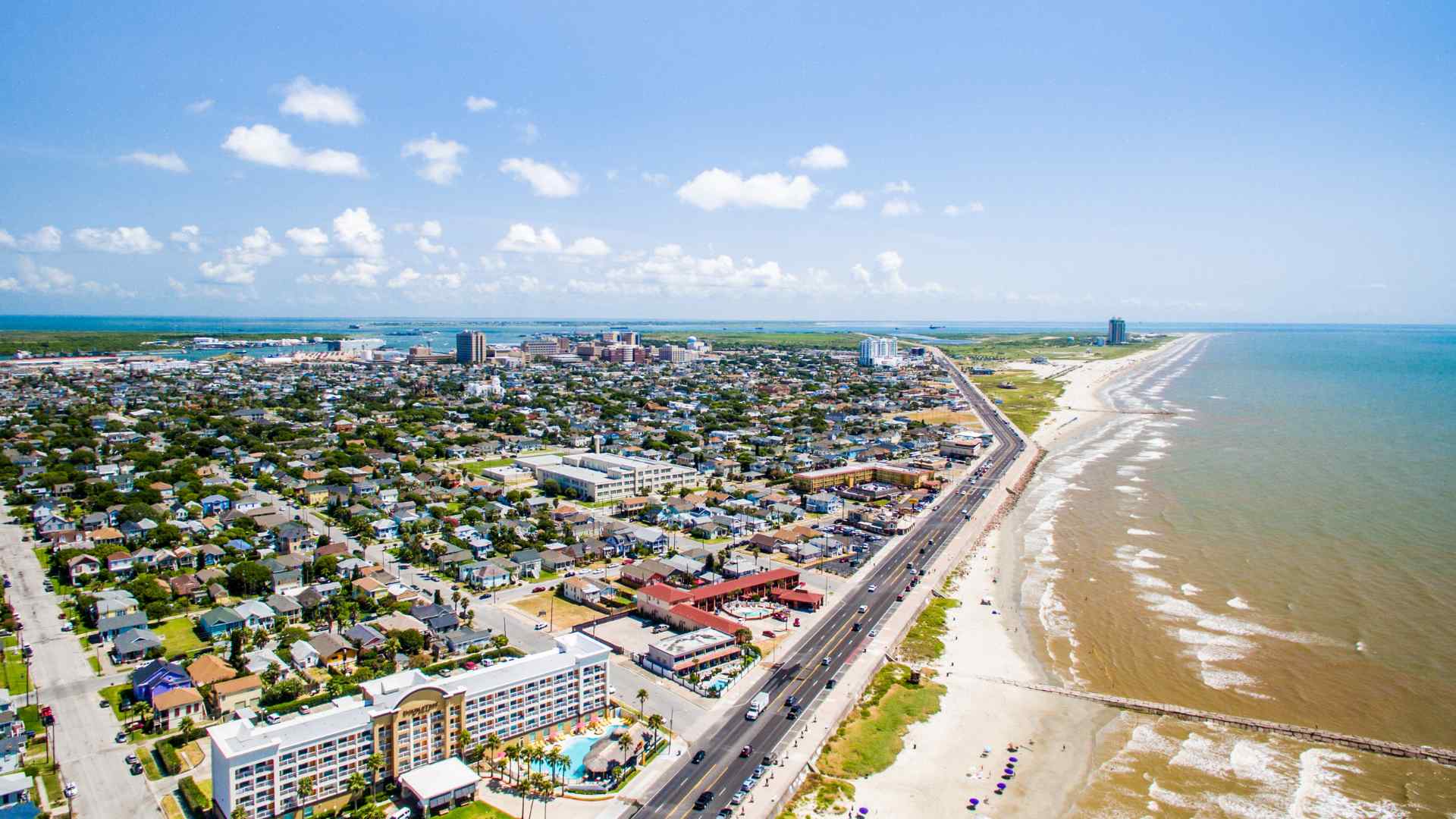 Aerial view of Galveston beachfront neighborhoods and the Gulf shoreline