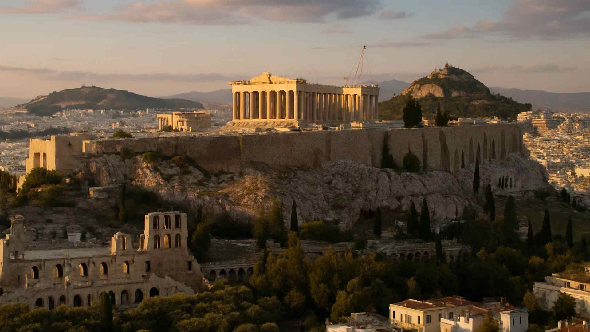 The Parthenon and Acropolis rising above Athens at sunset
