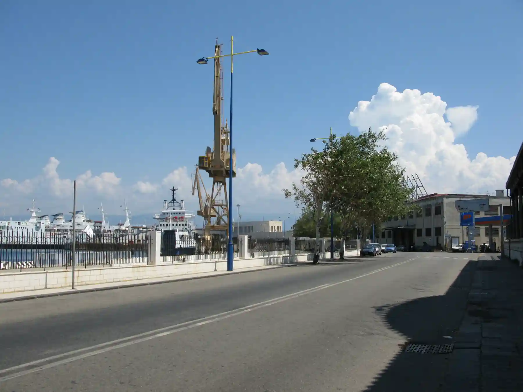 Central waterfront and port cranes at the Port of Messina, Sicily.
