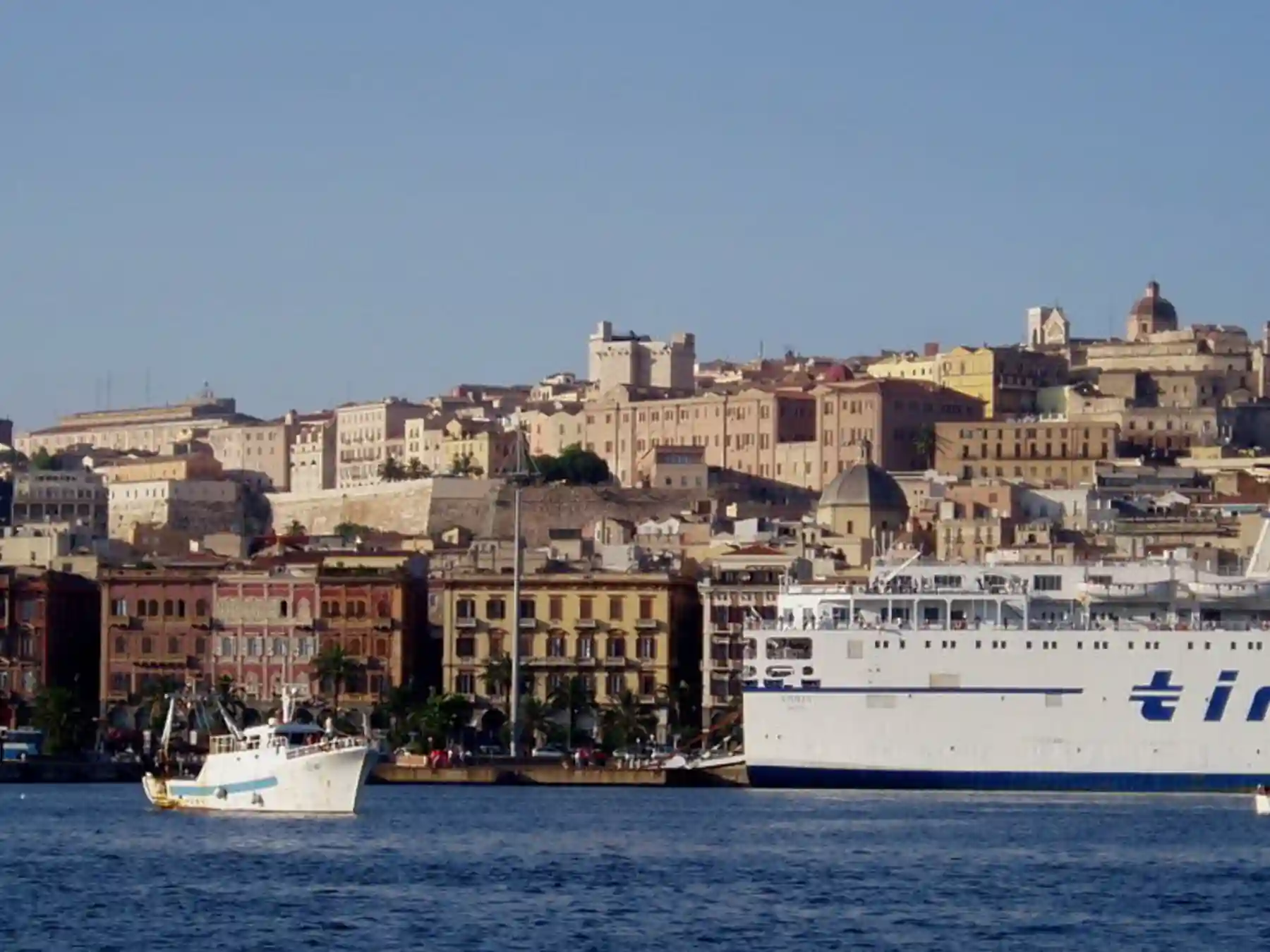 Ferry passing the waterfront of Cagliari, Sardinia.