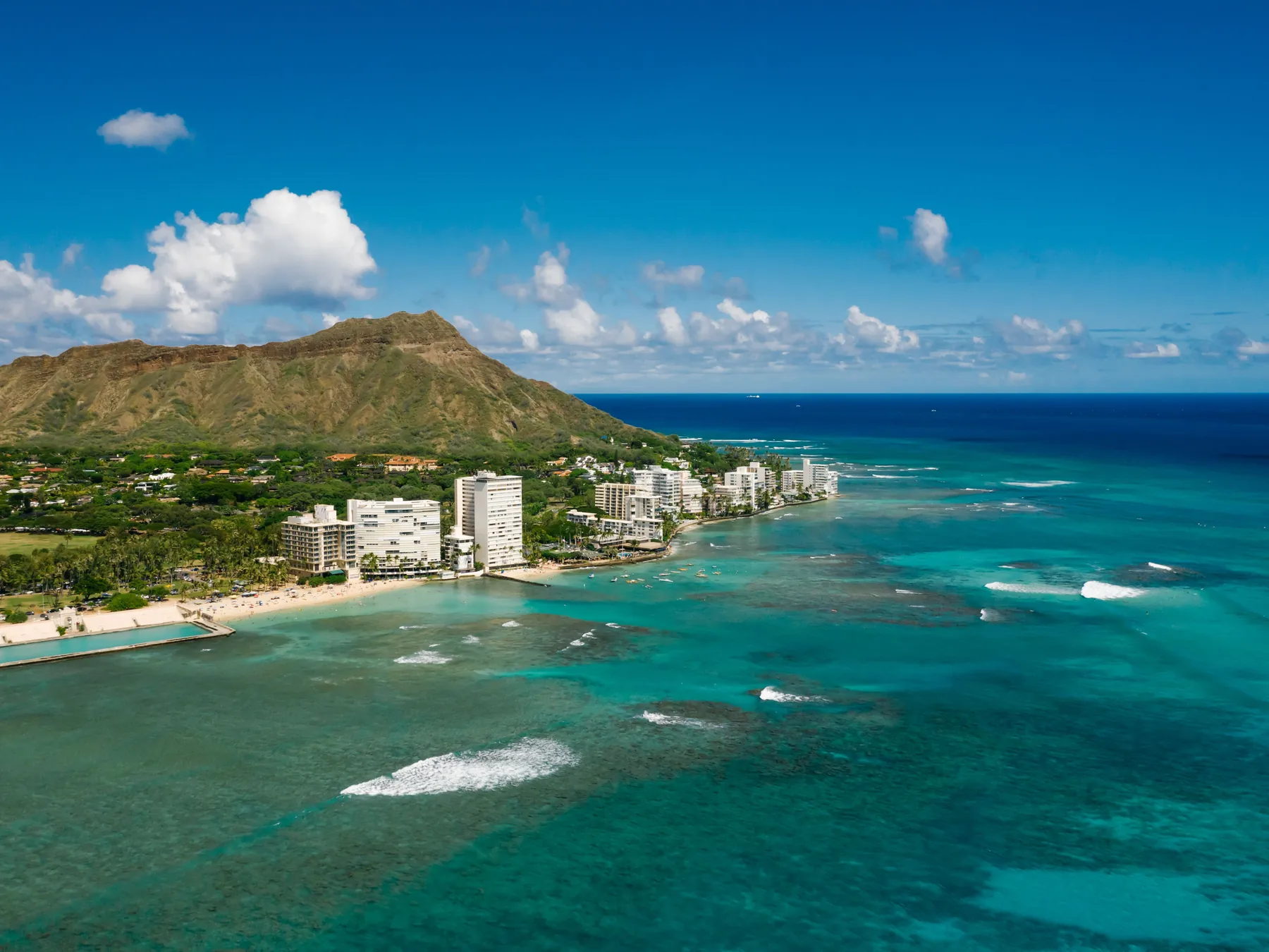Aerial view of Diamond Head and the turquoise coast of Honolulu.
