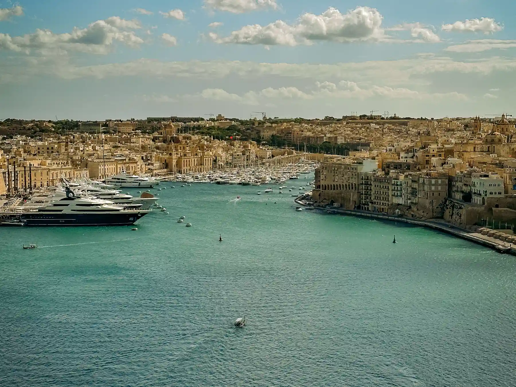 Aerial view of yachts and historic waterfront buildings around Valletta’s Grand Harbour.
