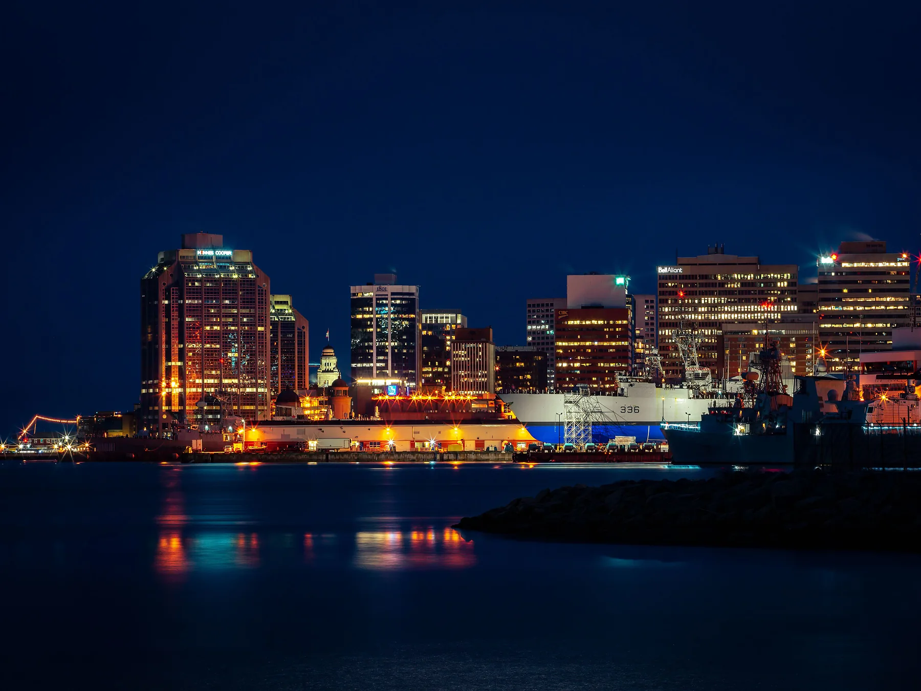 Halifax waterfront skyline reflected in the harbor at night