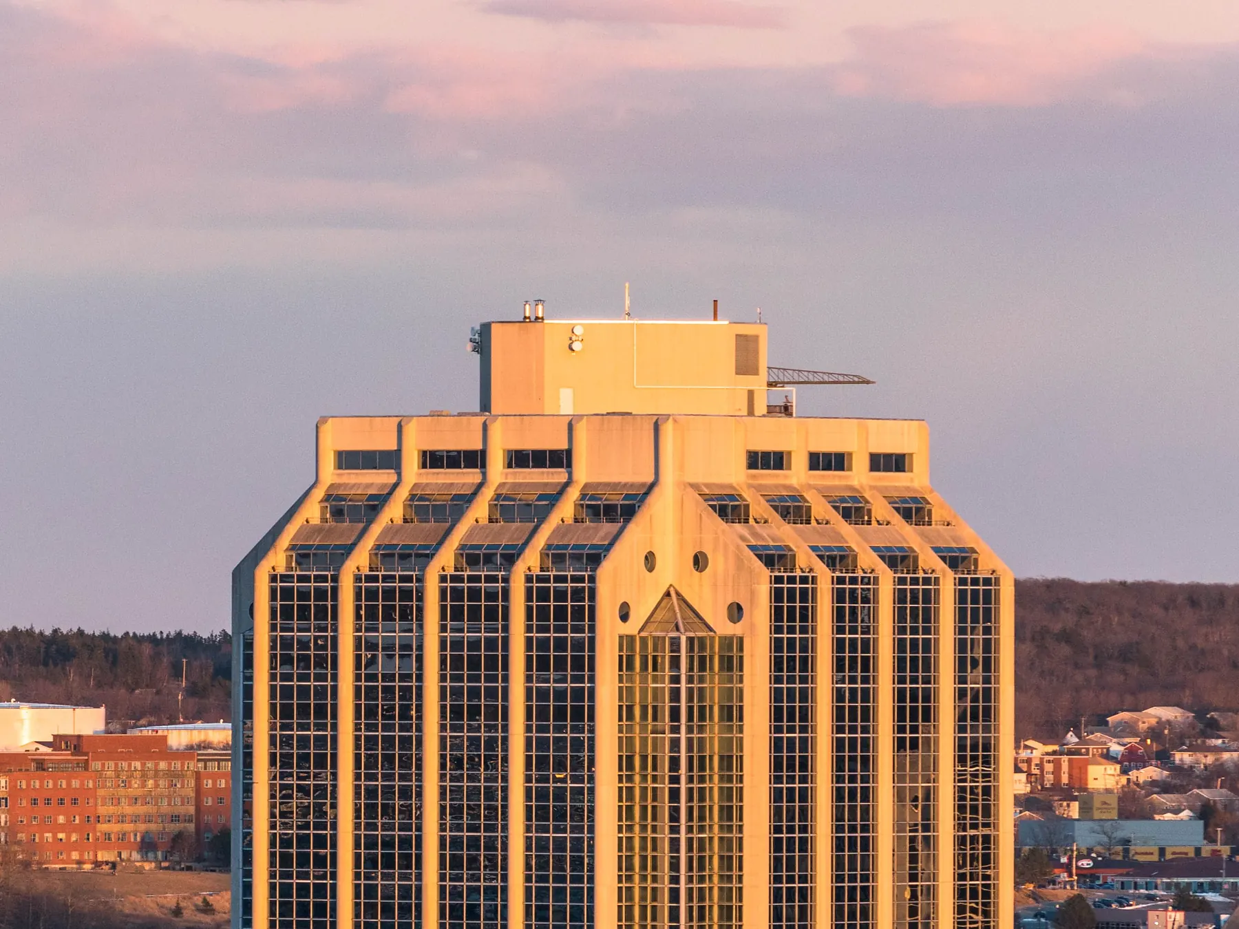 Purdy's Wharf towers beside Halifax harbor at sunset