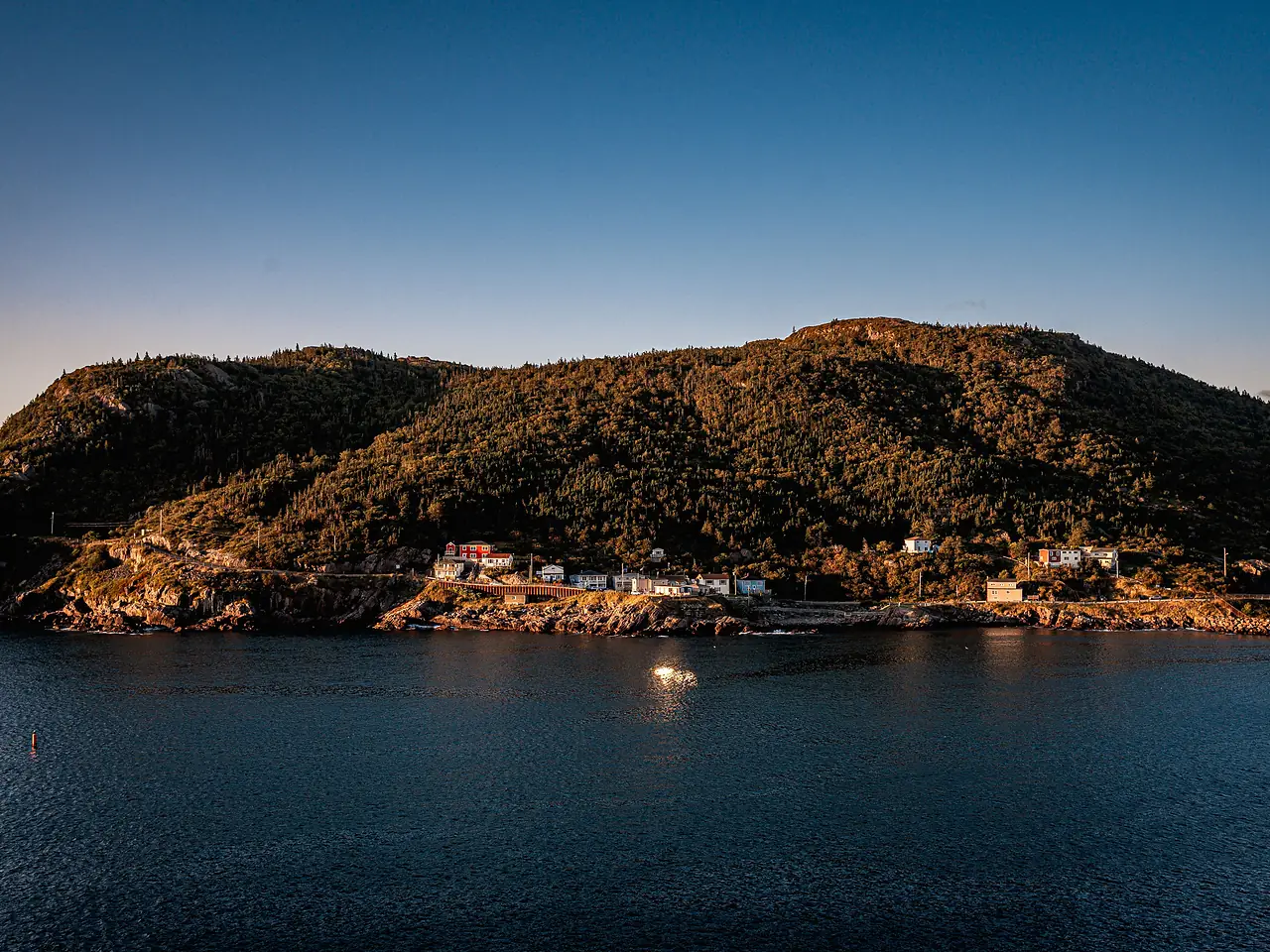 St. John's harbor framed by steep green hills in Newfoundland