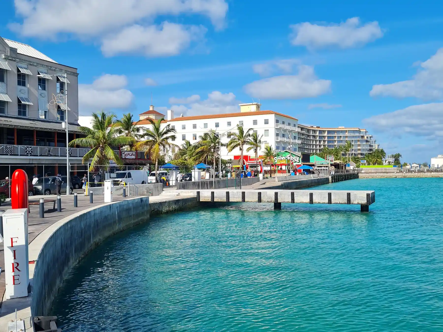 Clear blue water and the Nassau harbor waterfront under a sunny sky.