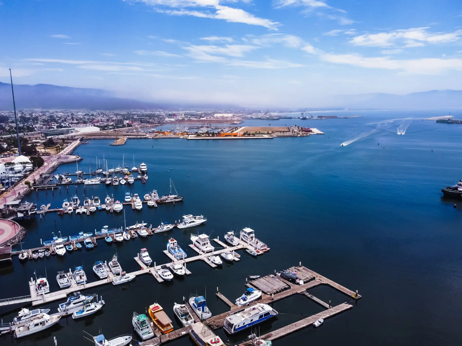 Aerial view of boats and docks in Ensenada marina and harbor.