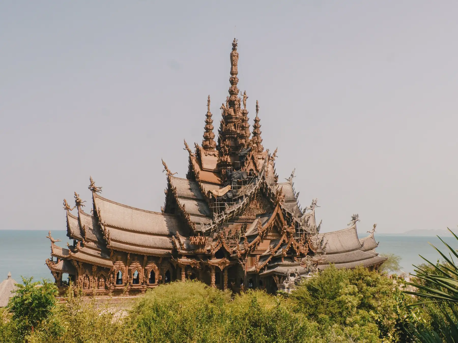 Intricate wooden roof of the Sanctuary of Truth beside the sea in Pattaya.