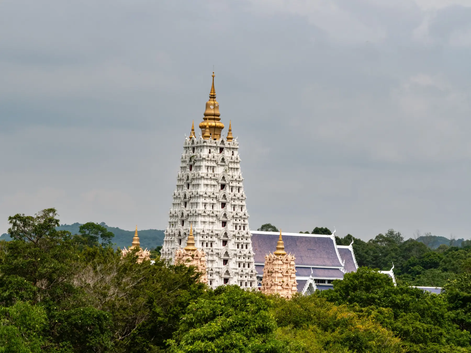 Wat Yansangwararam temple surrounded by lush greenery near Pattaya, Thailand.
