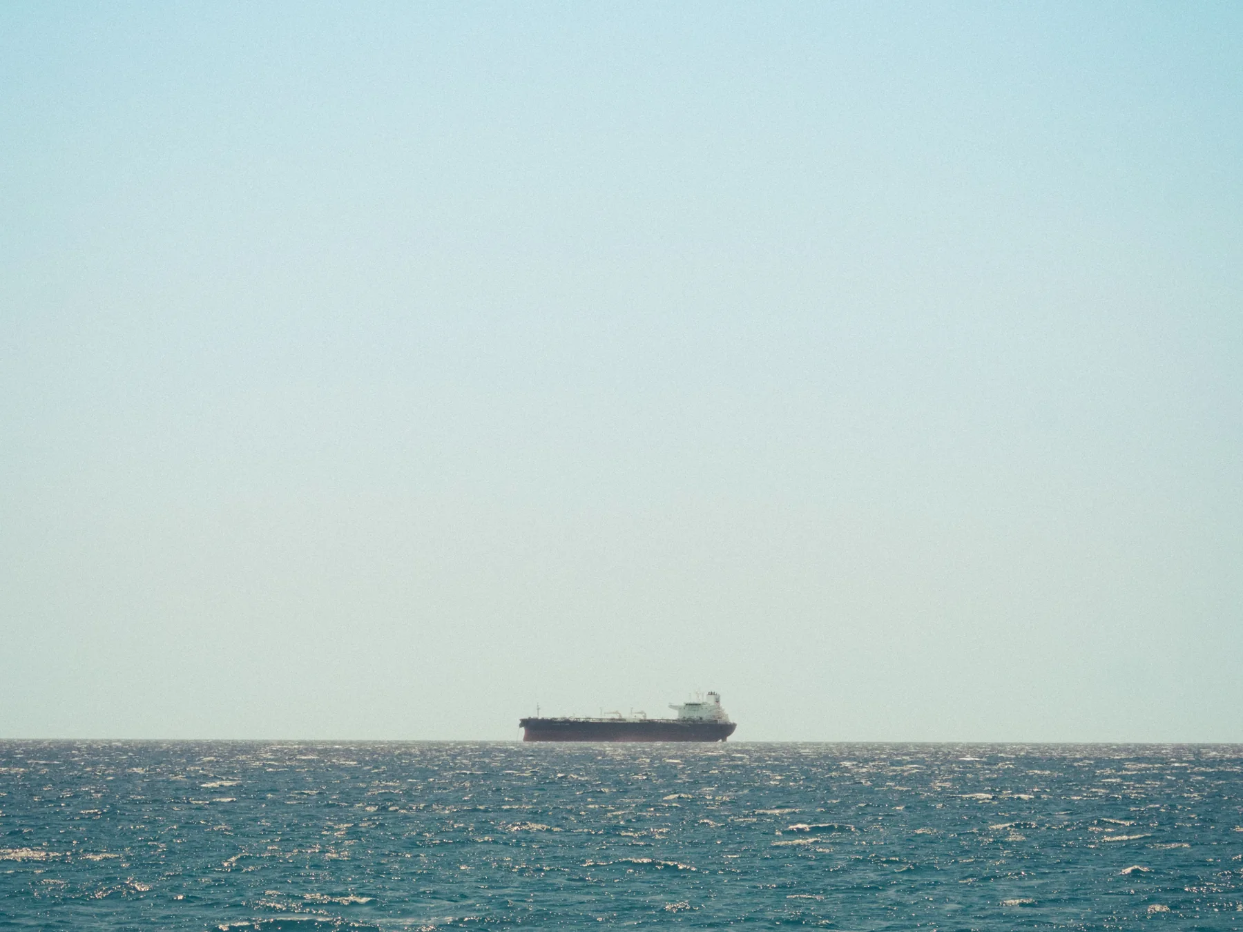 Large cargo ship on the Caribbean Sea off Oranjestad, Aruba.