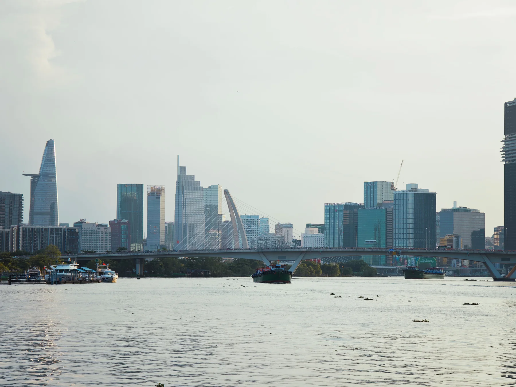 Modern Ho Chi Minh City skyline seen across the Saigon River.
