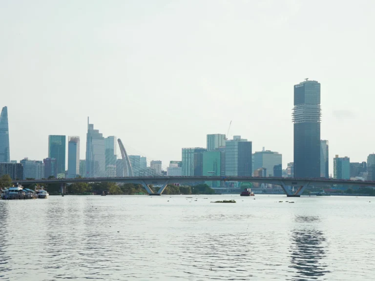 Panoramic view of Ho Chi Minh City's skyline across the Saigon River.