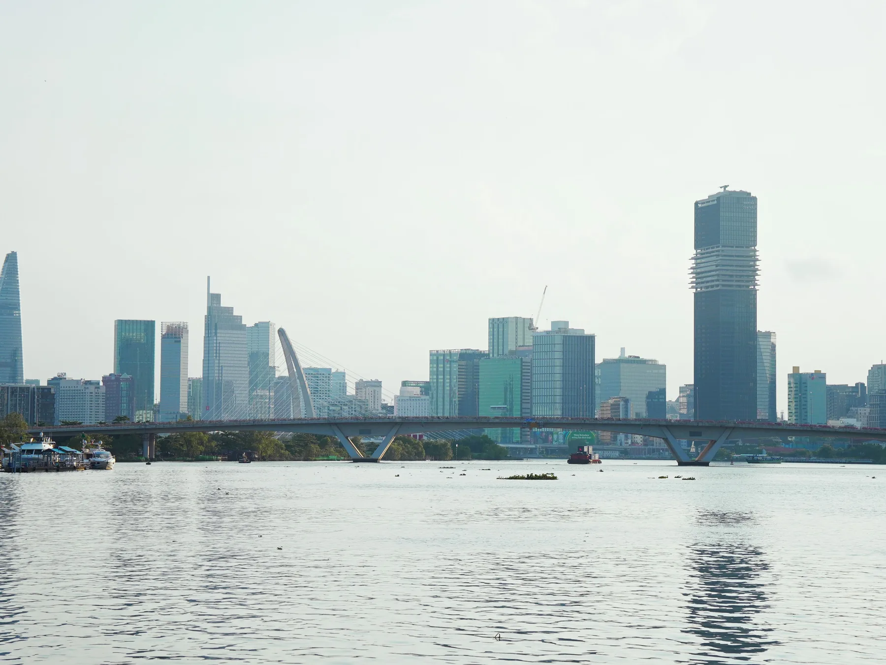 Panoramic view of Ho Chi Minh City's skyline across the Saigon River.