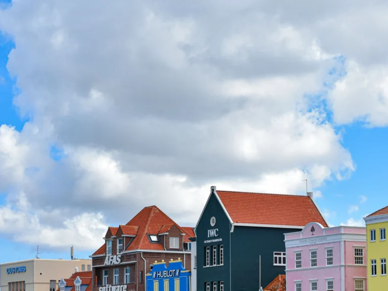 Colorful Dutch colonial buildings along the Willemstad waterfront in Curaçao.