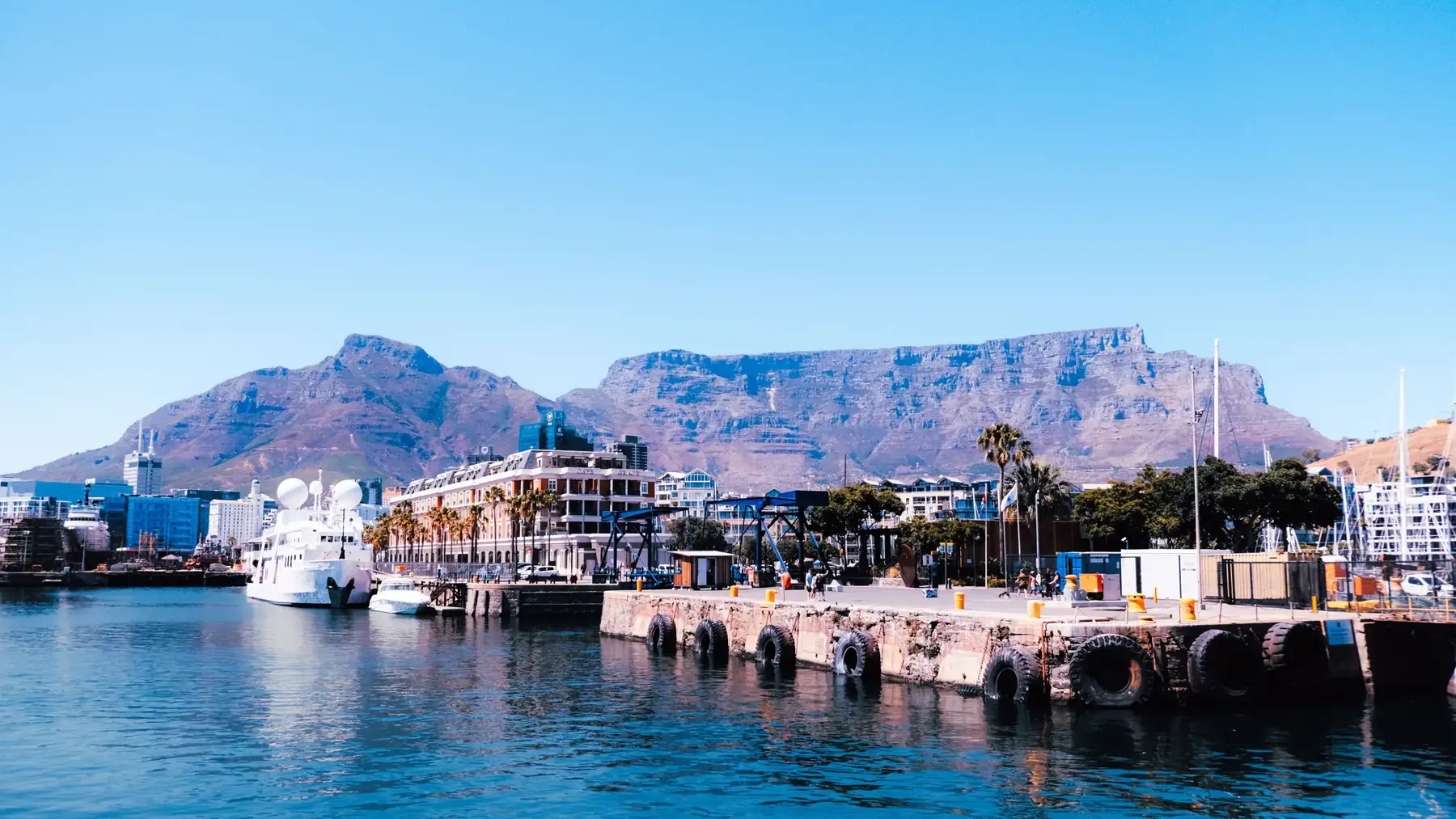 Cape Town harbor and waterfront with Table Mountain in the background.