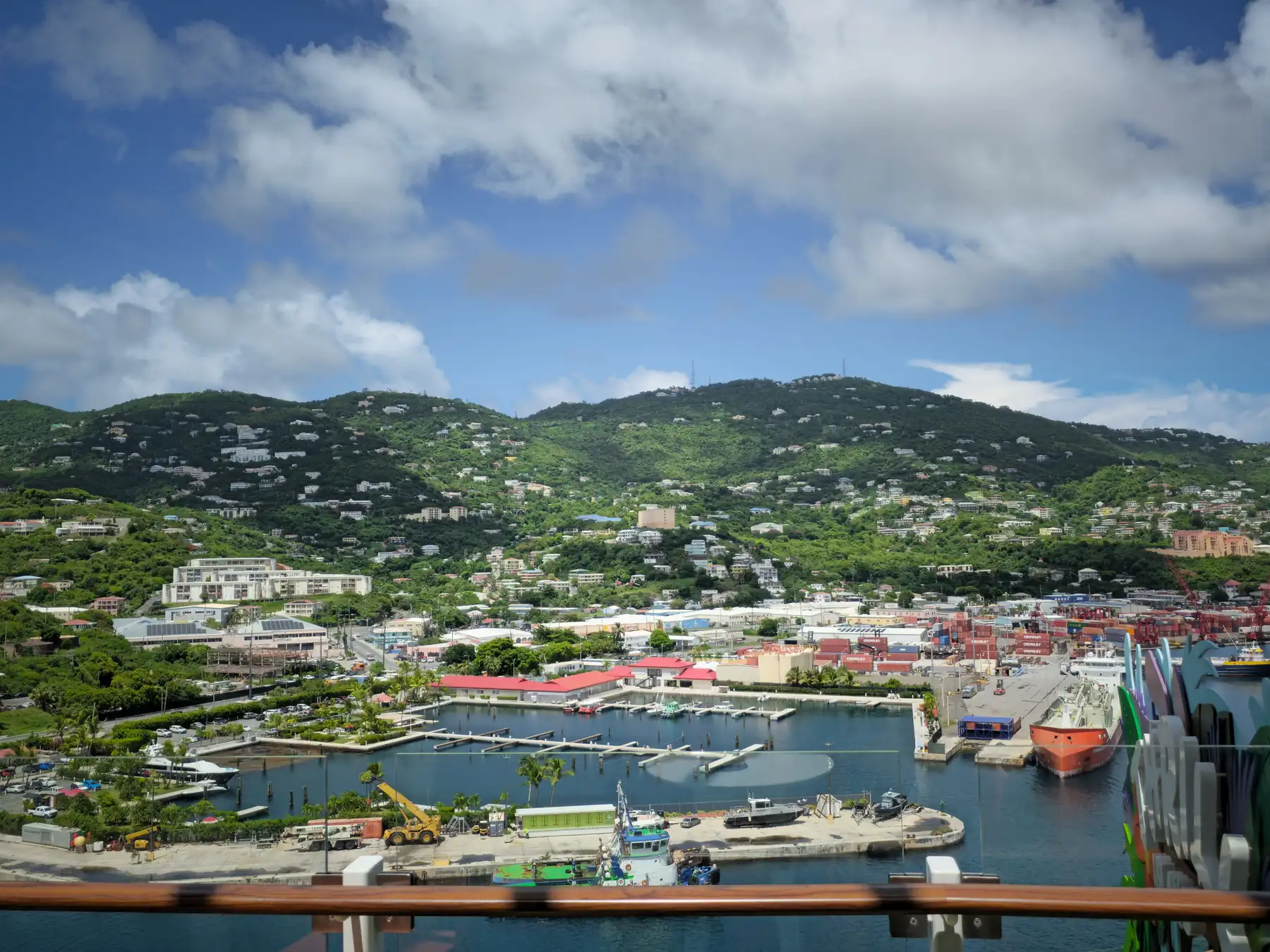 Charlotte Amalie harbor, waterfront buildings, and green hills in St. Thomas.