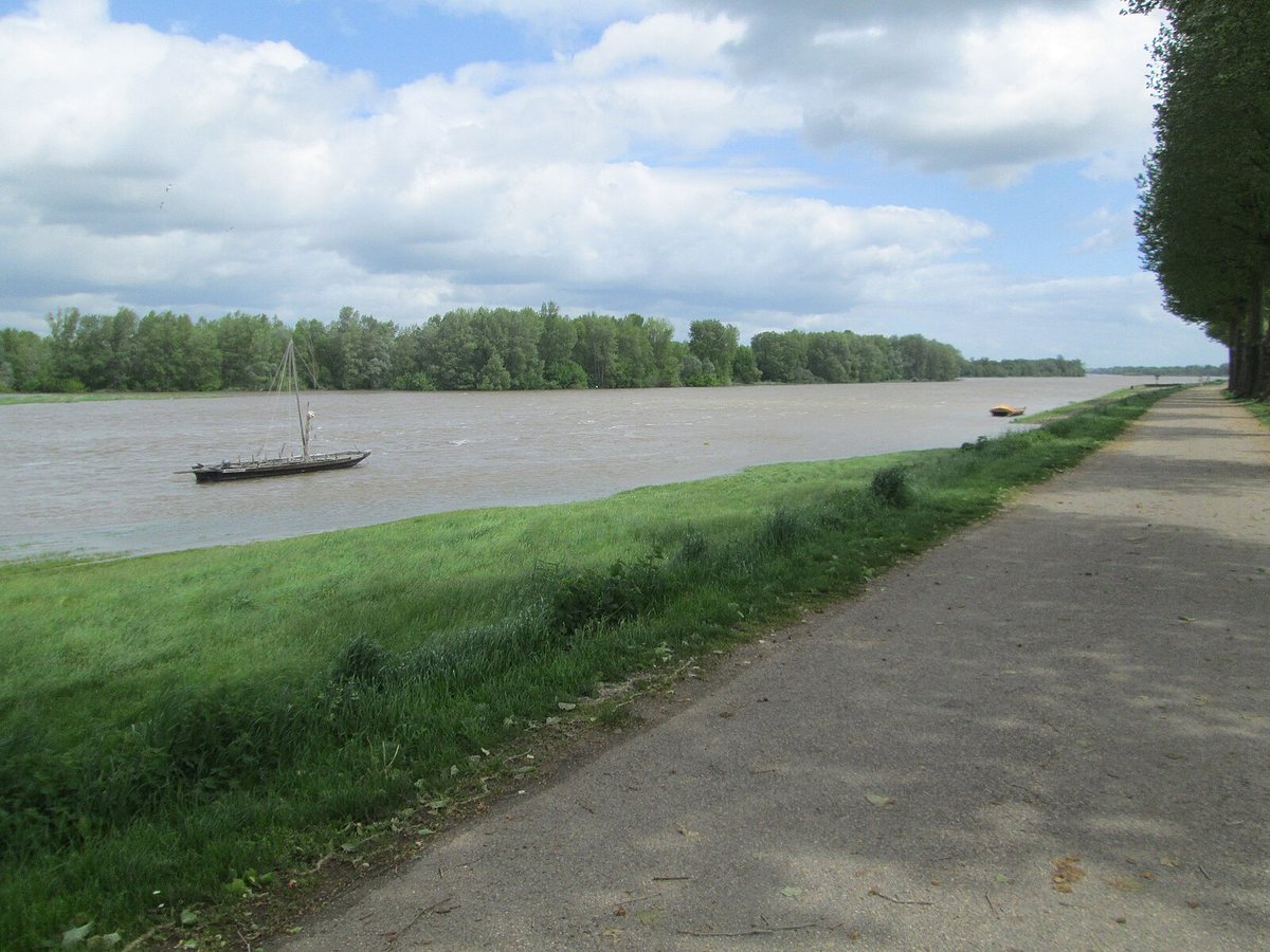 A quiet river winds through the French countryside