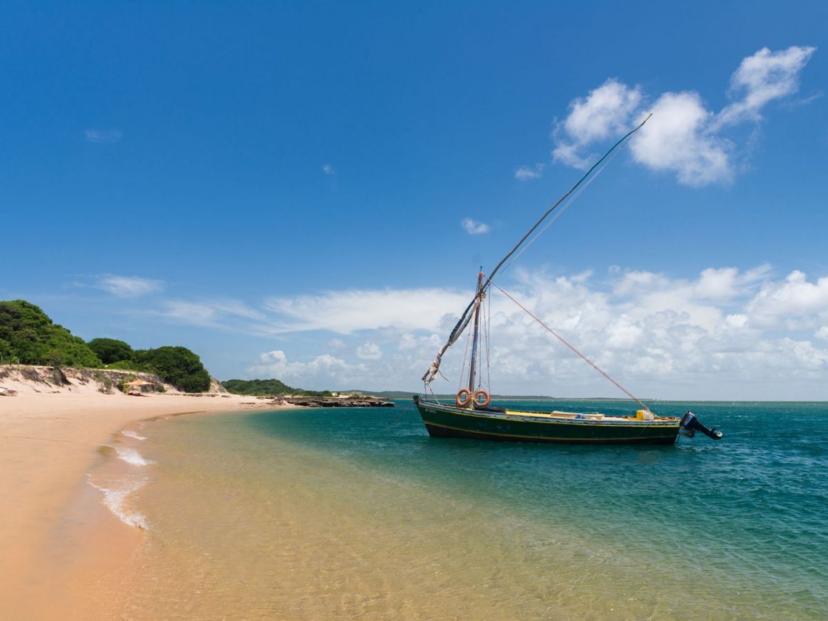 Traditional boat in clear water off Portuguese Island, Mozambique