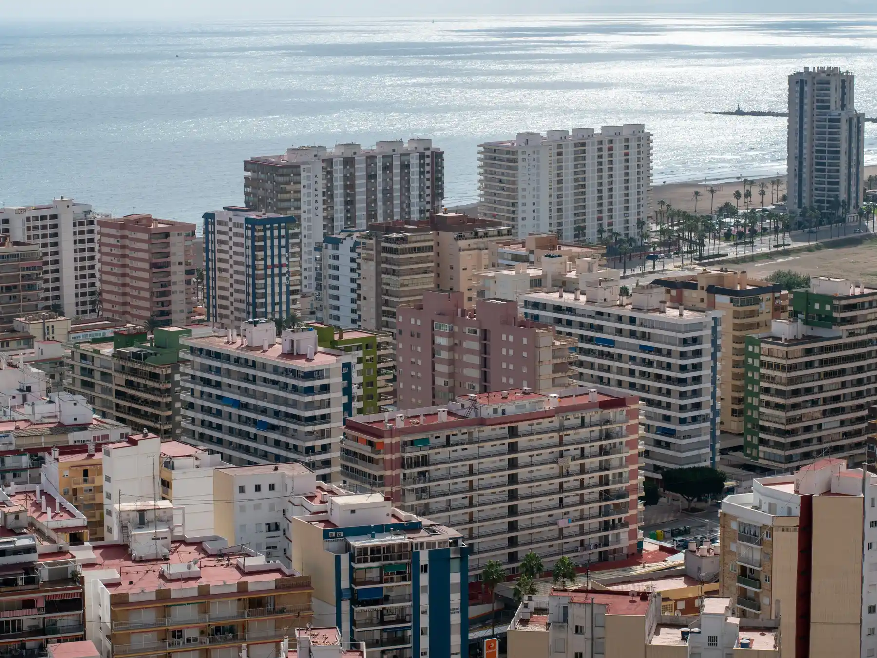 Aerial view of Valencia's coastal neighborhoods and Mediterranean shoreline.