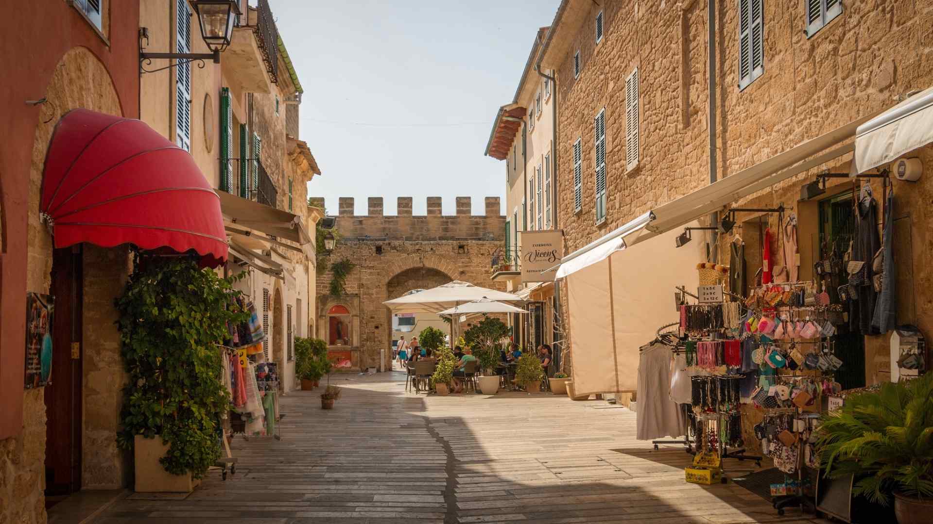 Pedestrian lane and medieval gate in Alcudia, Mallorca
