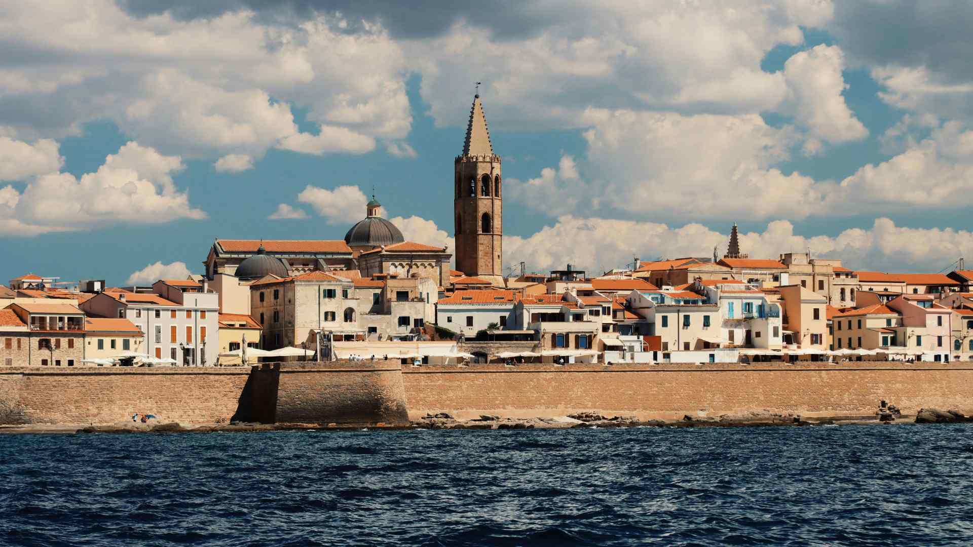 Alghero Old Town skyline viewed across the sea