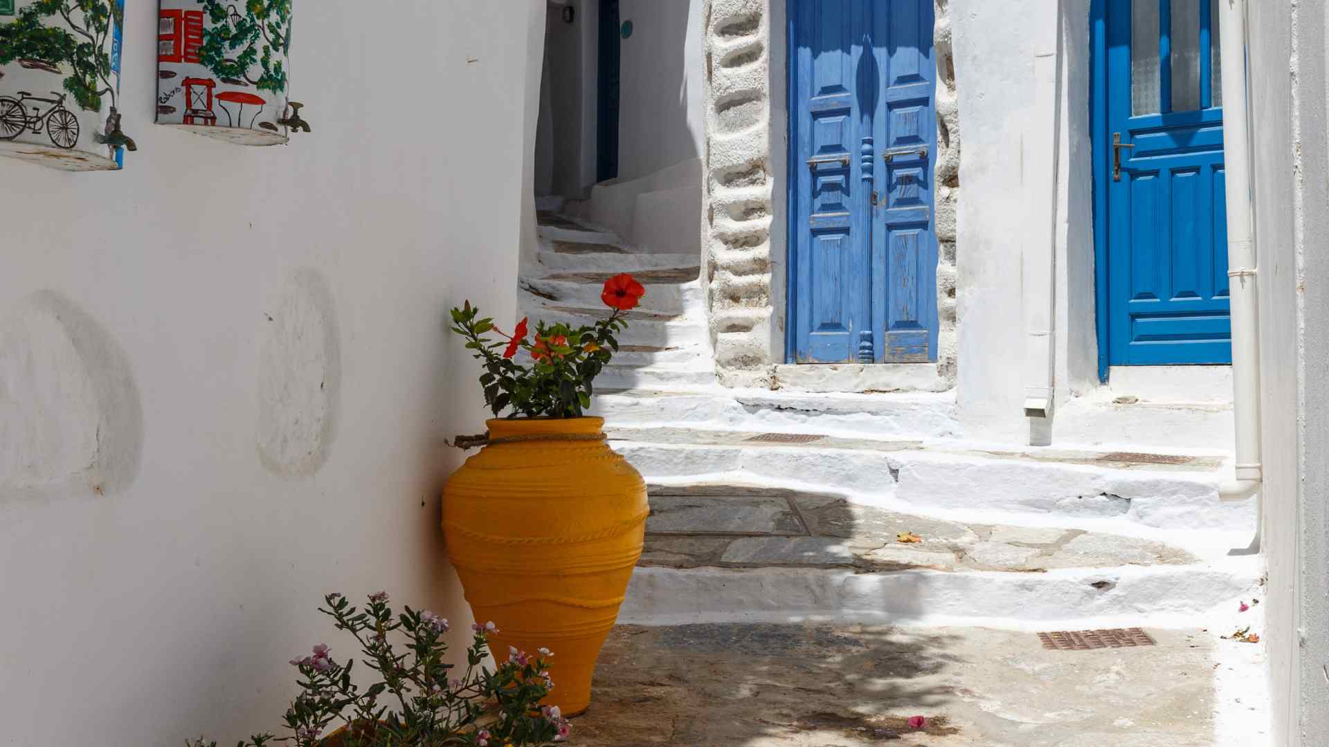 Whitewashed lane with blue doors on Amorgos