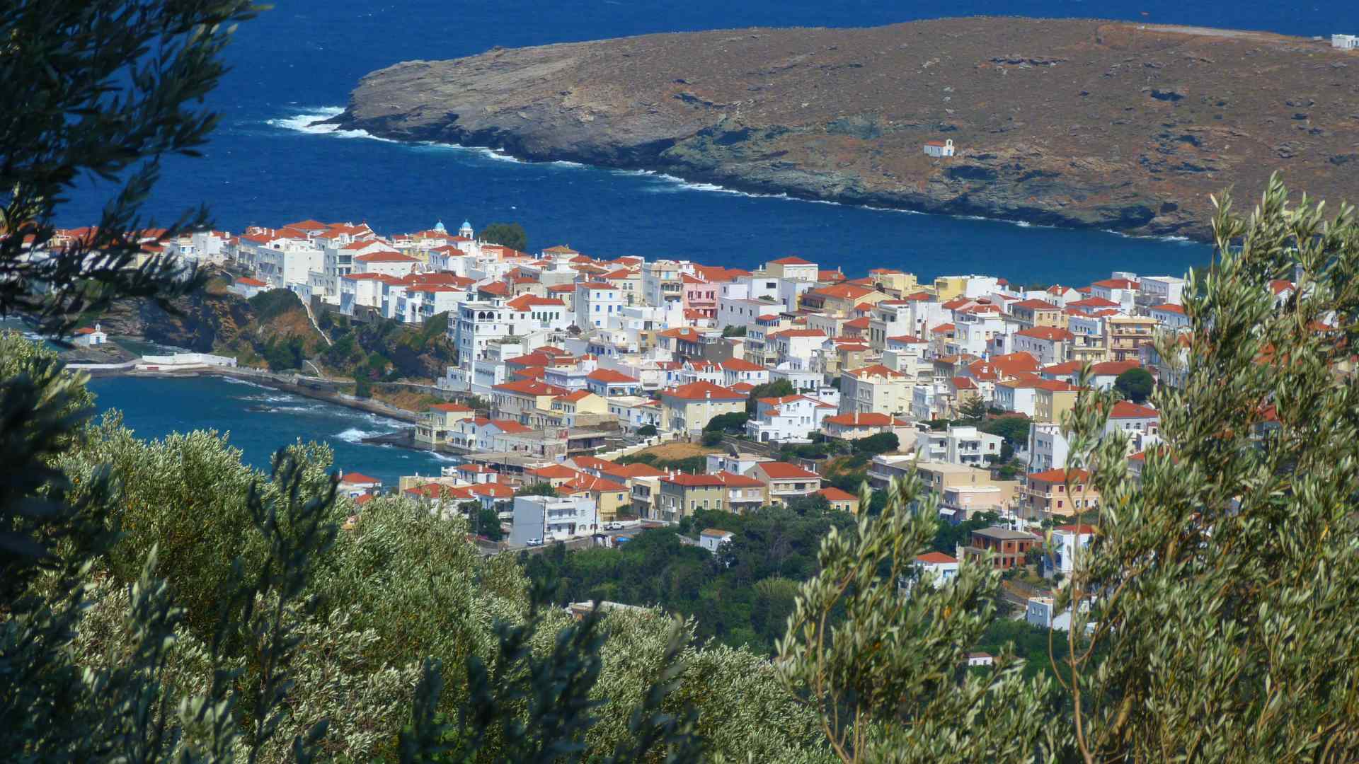 Red-roofed village overlooking a sheltered bay on Andros