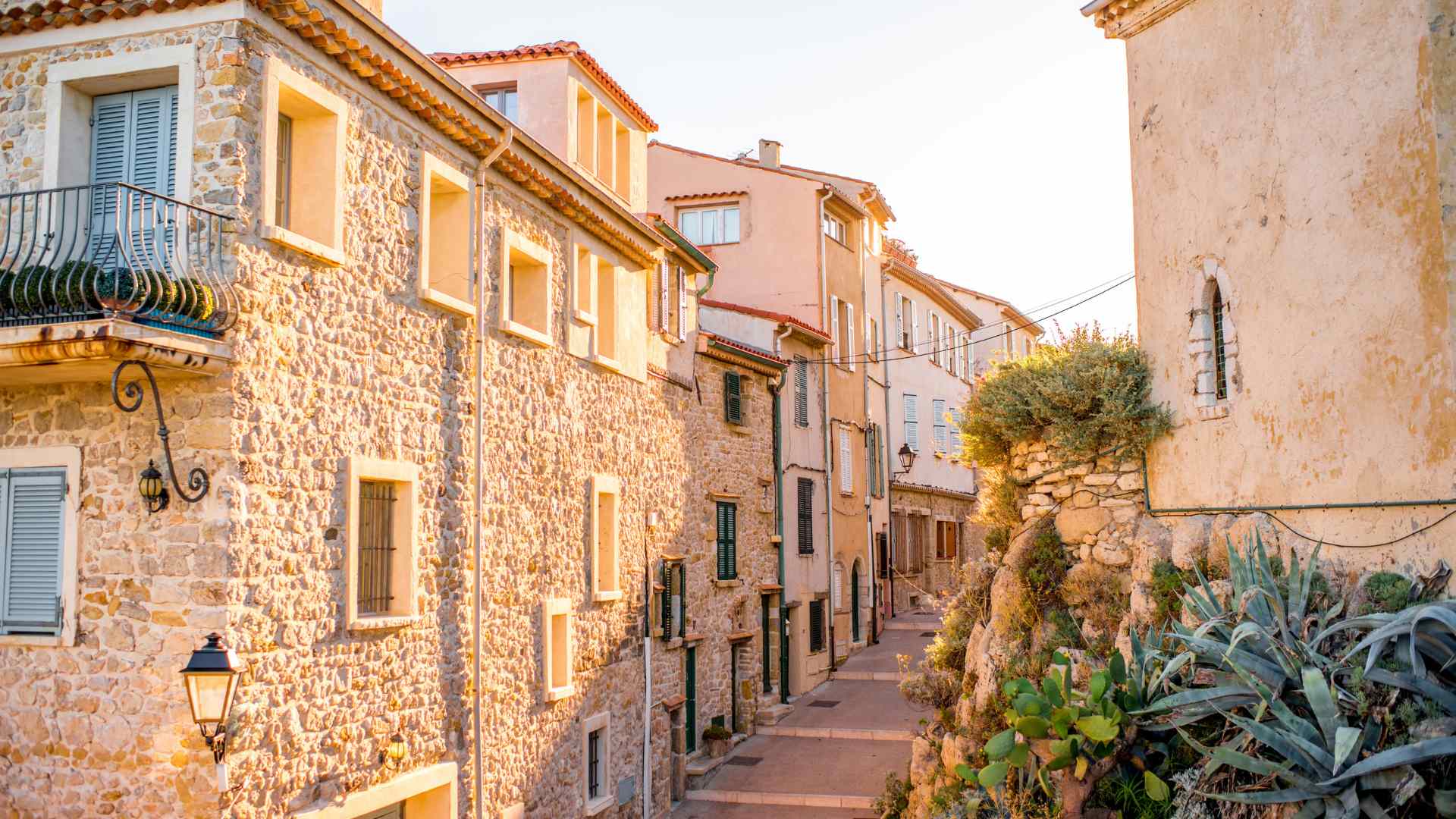 Warm stone lane through Antibes Old Town