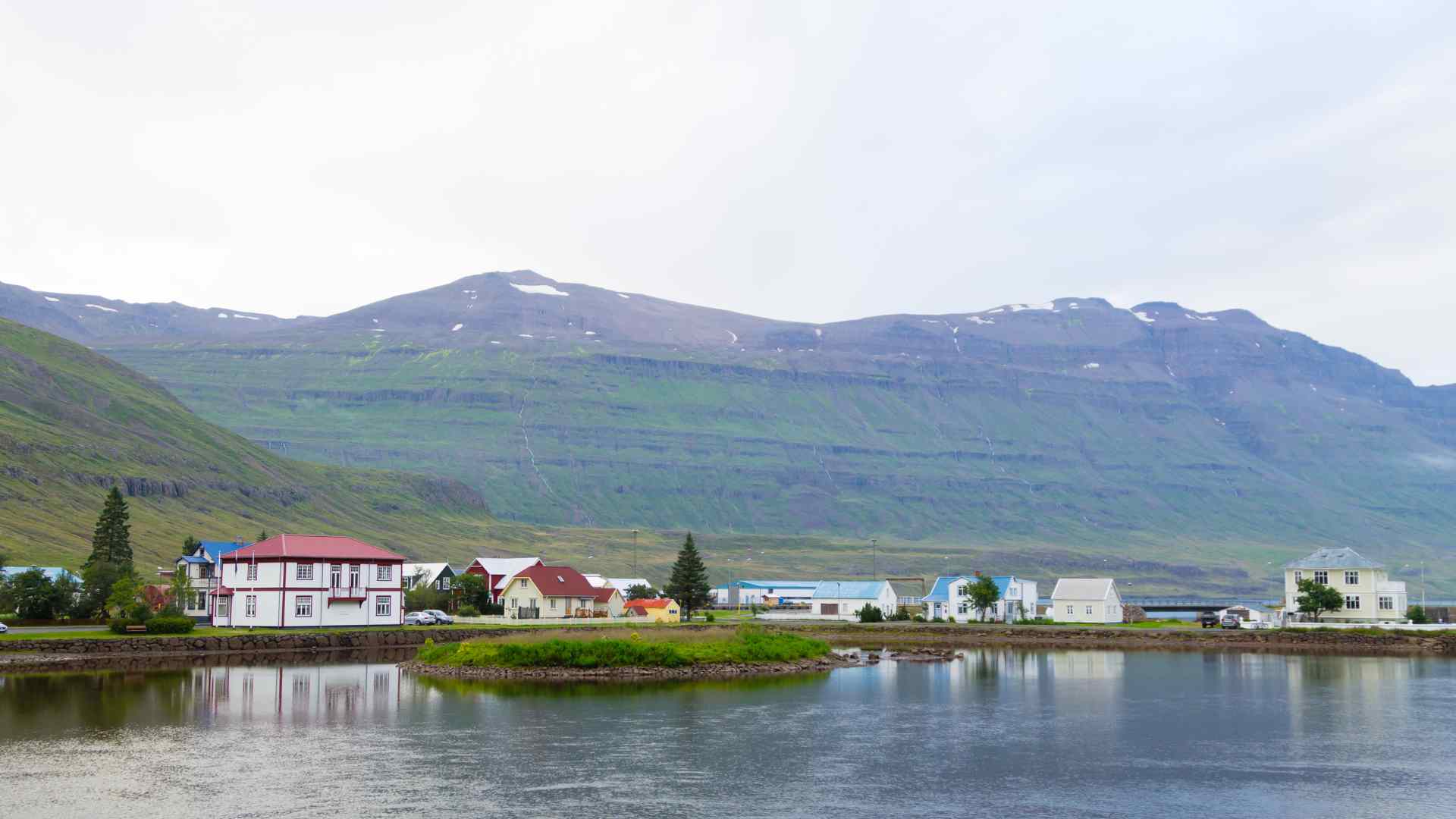 Waterfront village beneath broad mountains in northern Norway