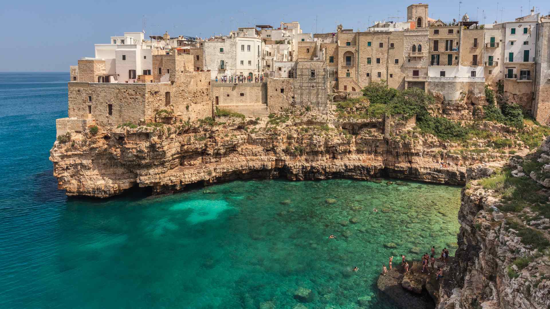 Clifftop homes above turquoise water in Polignano a Mare near Bari