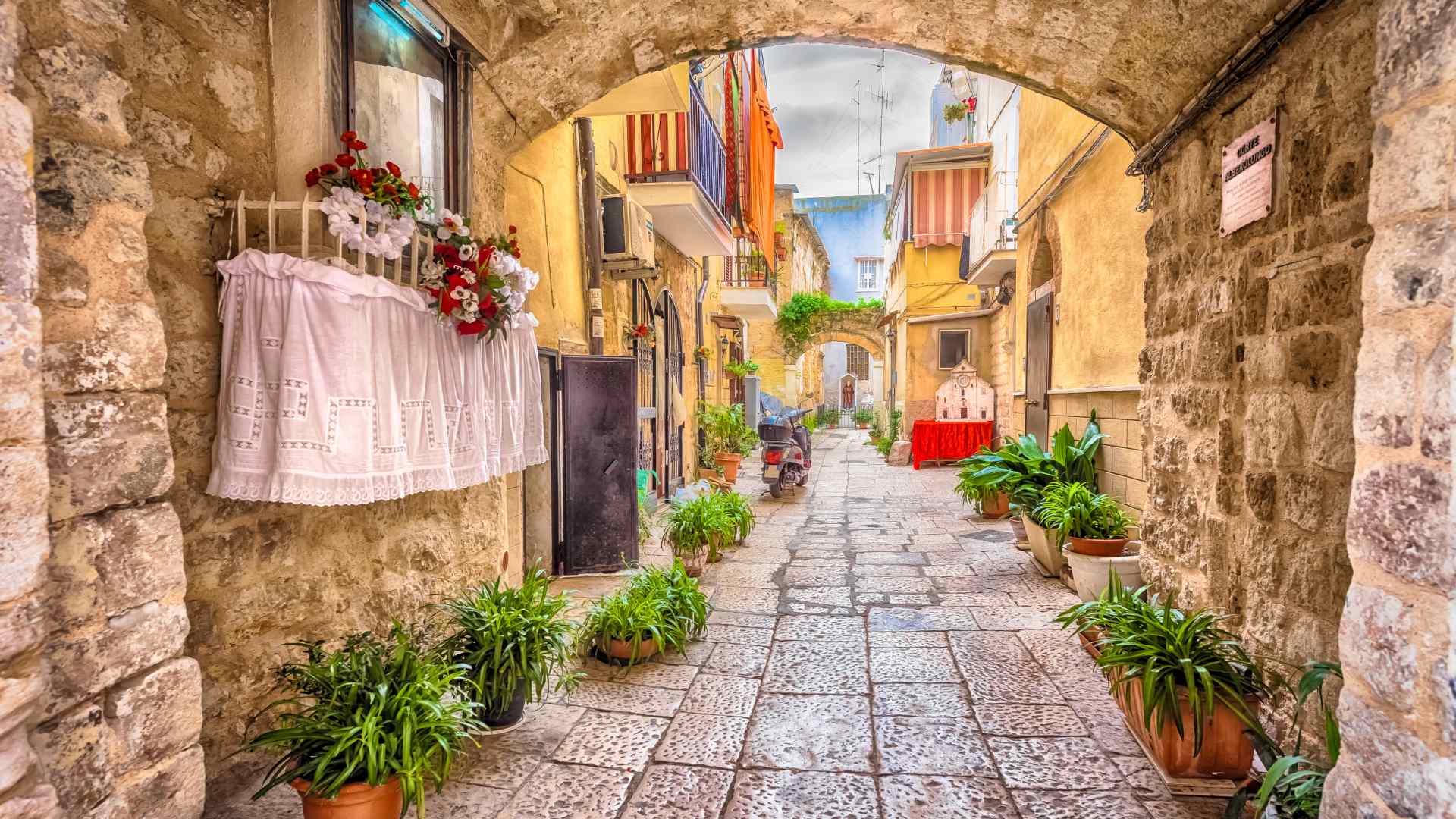 Stone lane with colorful homes in Bari's Old Town