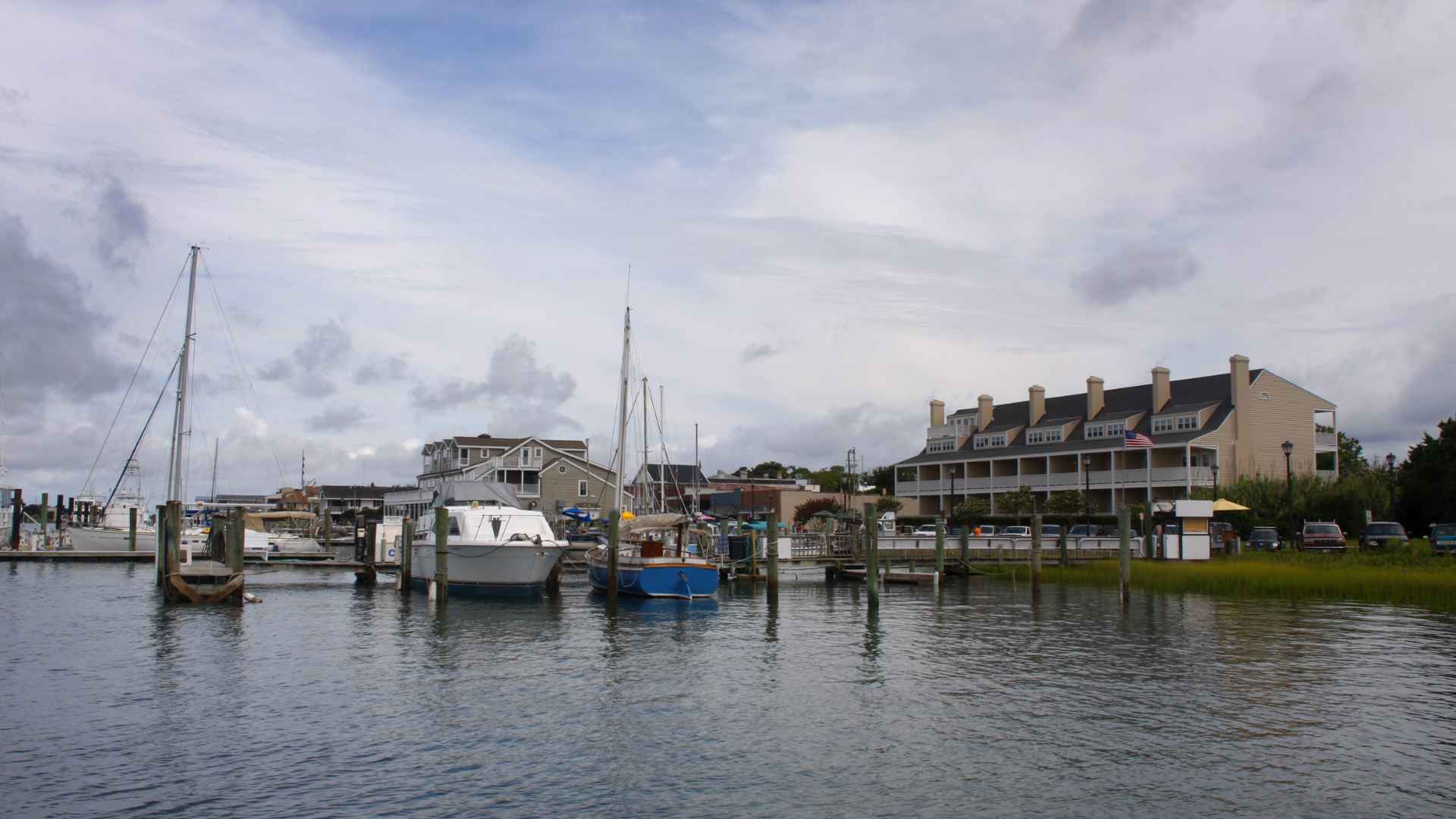 Boats in a harbor next to an inn in Beaufort