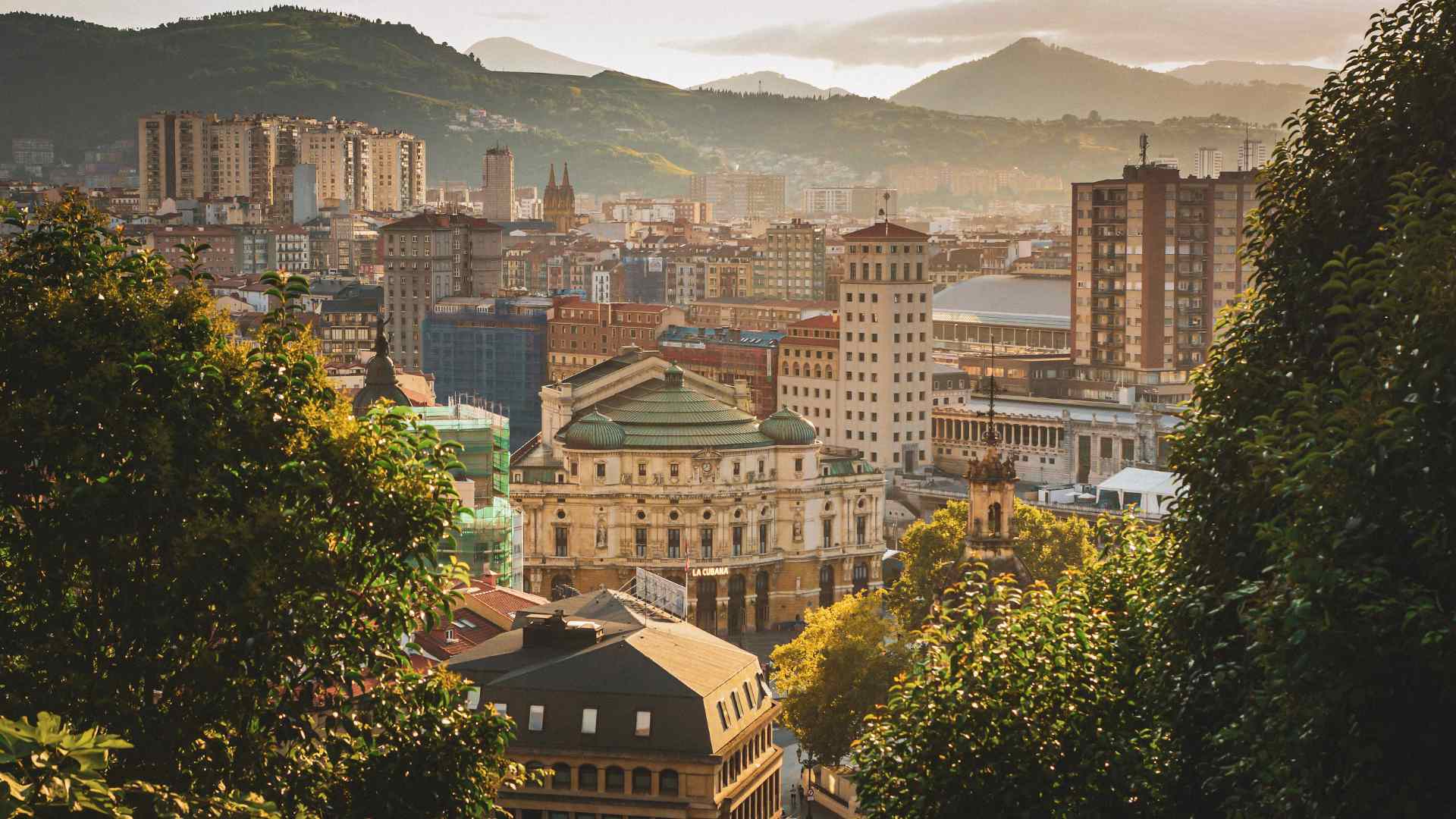 Bilbao city center and mountains in warm evening light