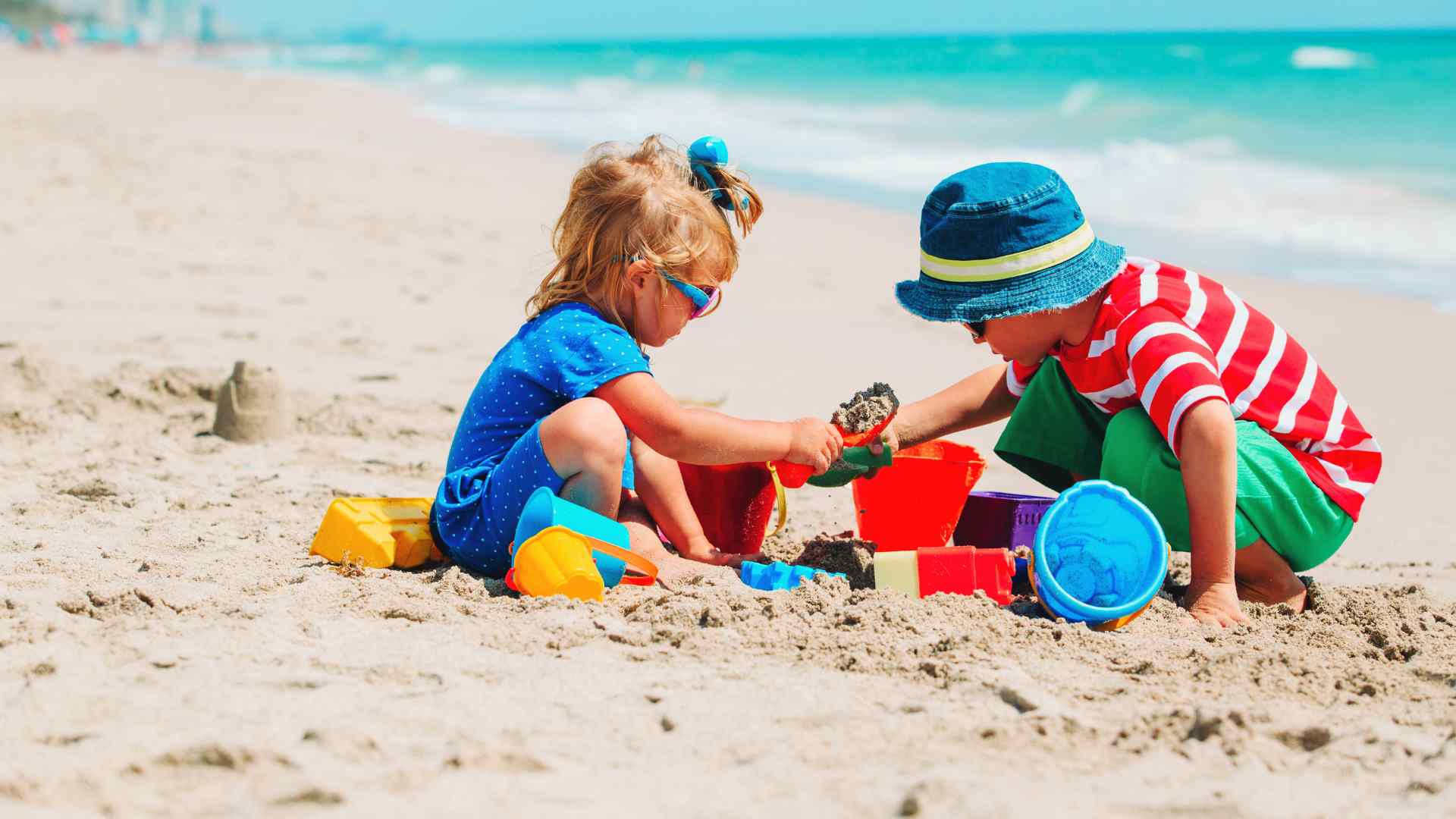 Children building a sandcastle on Castaway Cay