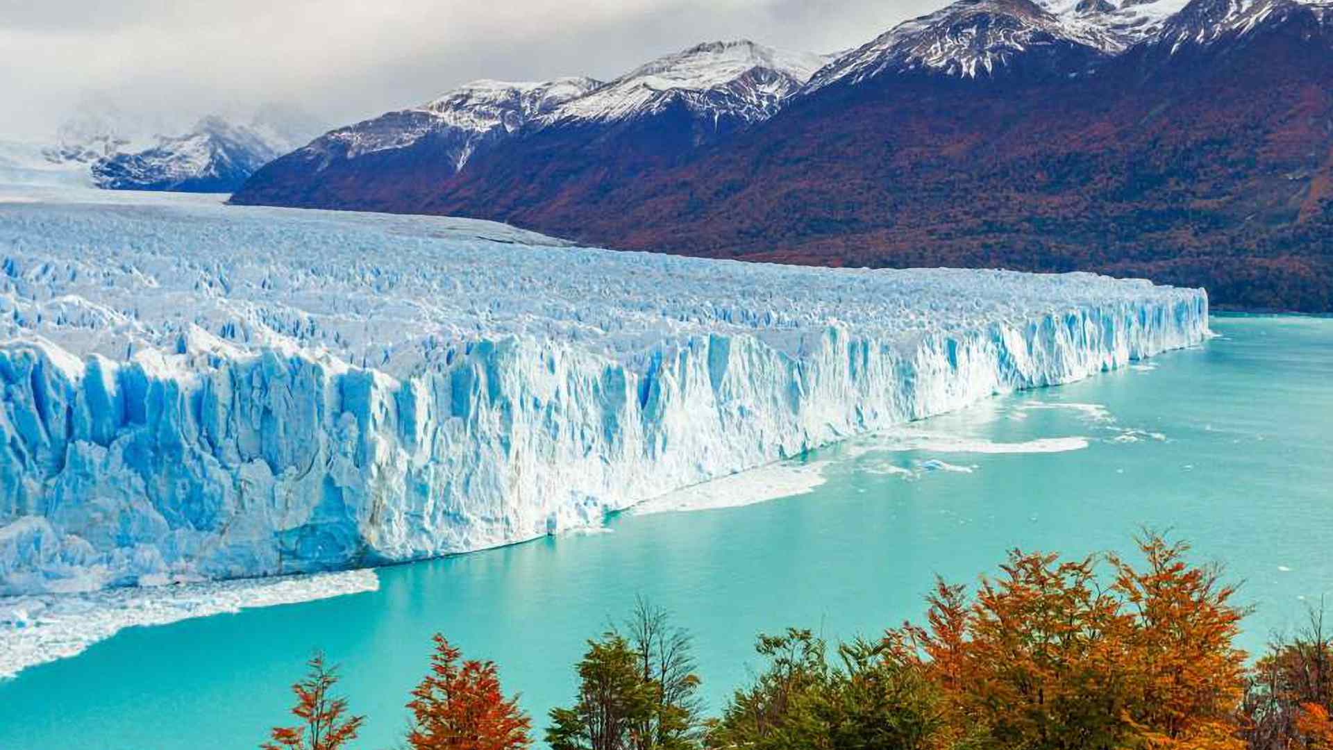 Blue tidewater glacier meeting the water in Glacier Bay