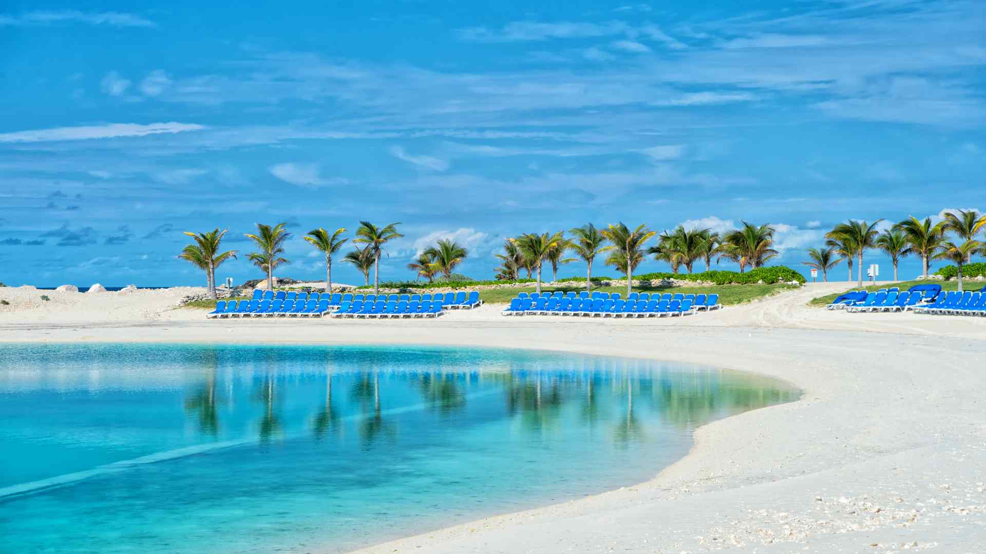 Palm-lined lagoon and white sand at Great Stirrup Cay