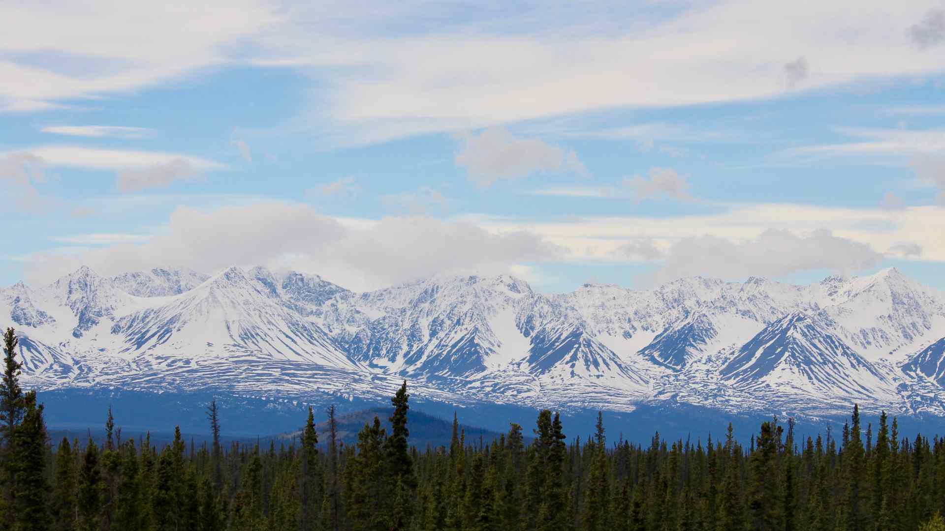 Snow-covered mountains across the water near Haines, Alaska