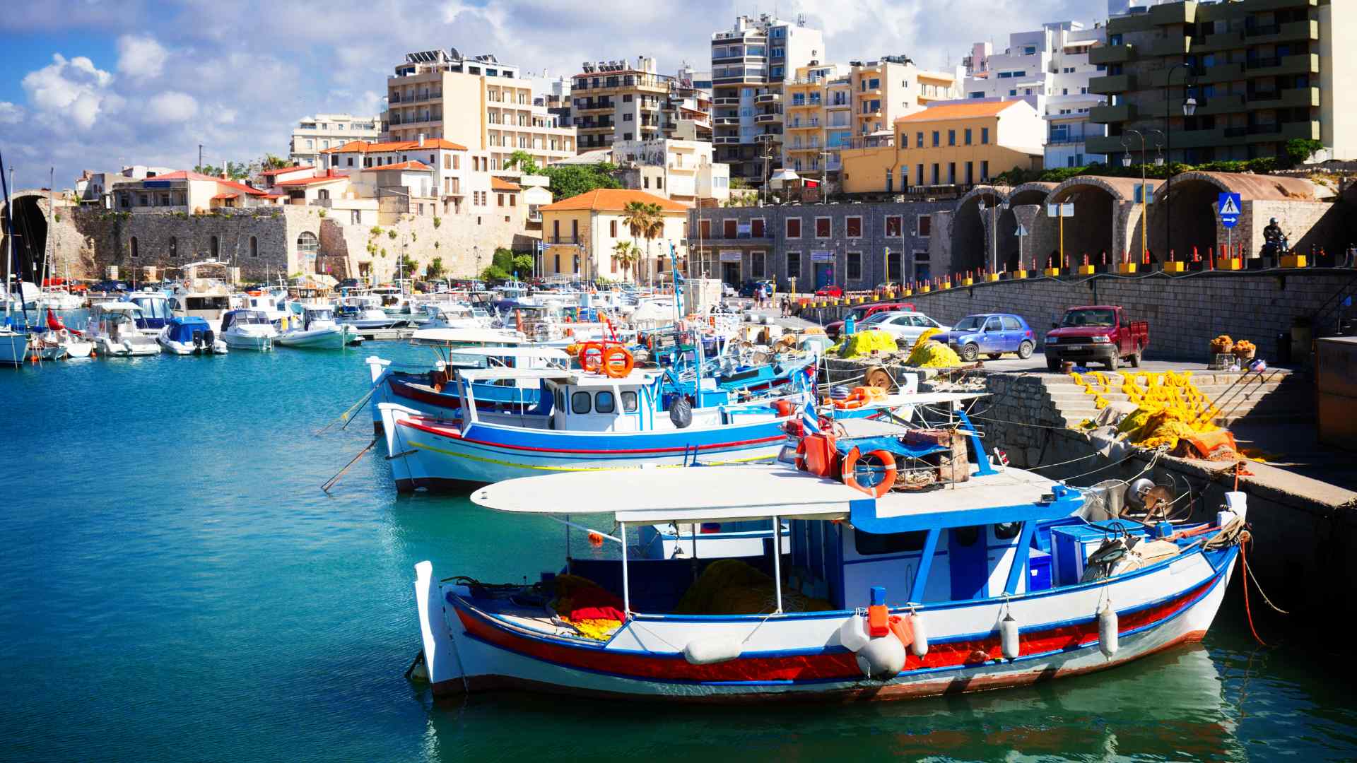 Colorful fishing boats in Heraklion's Venetian harbor, Crete