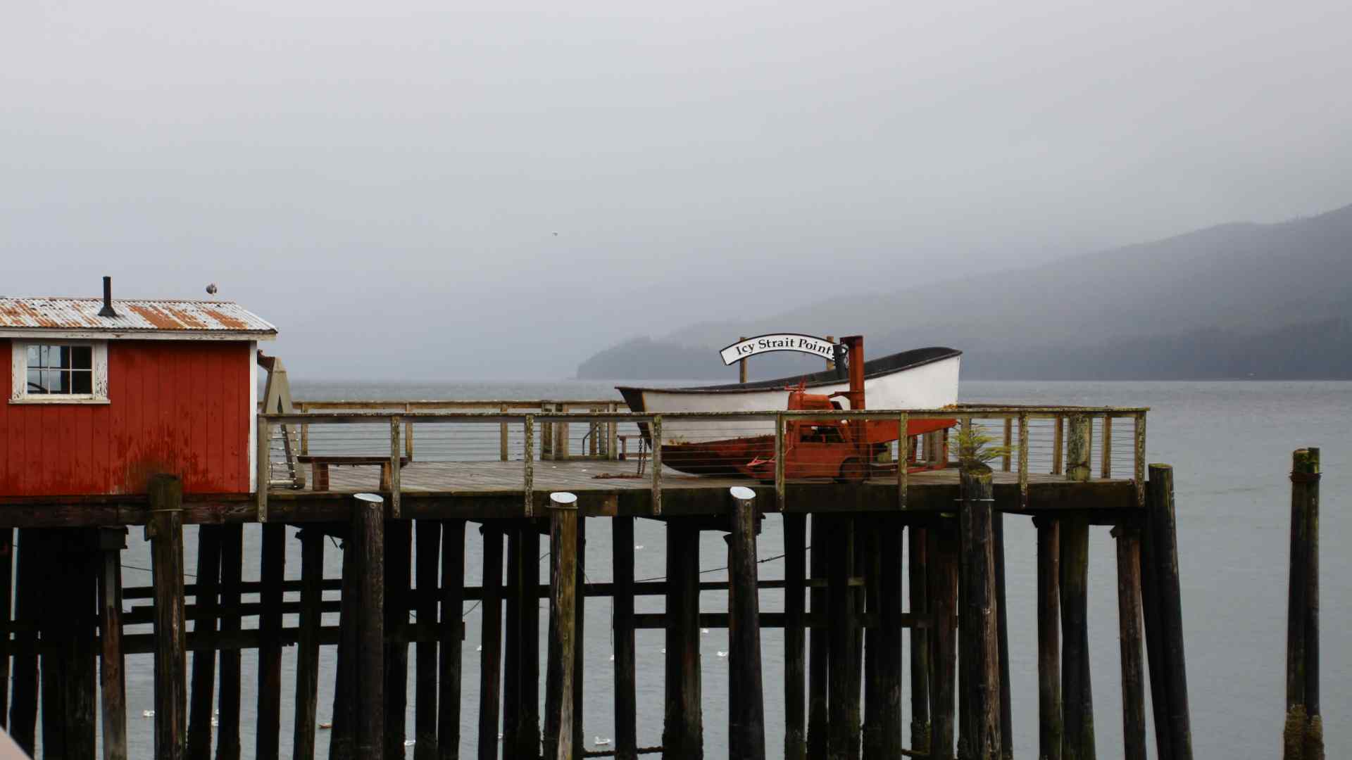 Wooden harbor buildings on pilings at Icy Strait Point