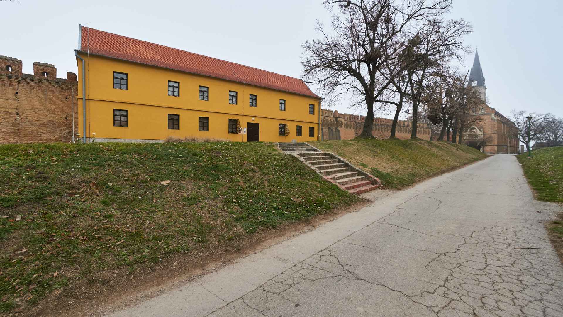 Yellow long building along road in Croatia