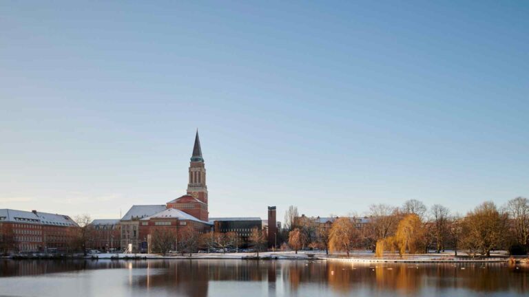 Kiel Town Hall reflected in the lake at sunset