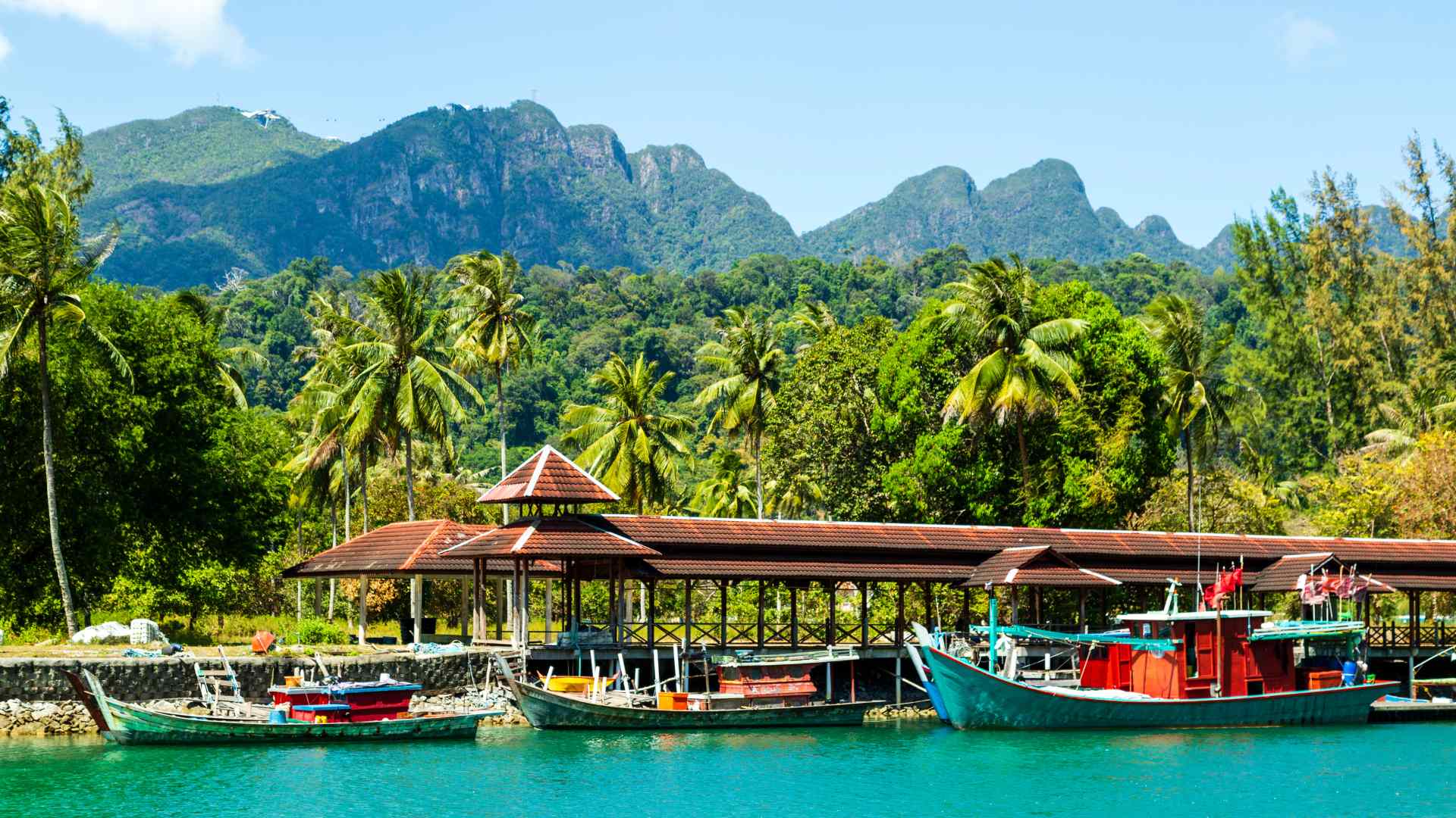 Tropical Langkawi marina framed by forested mountains