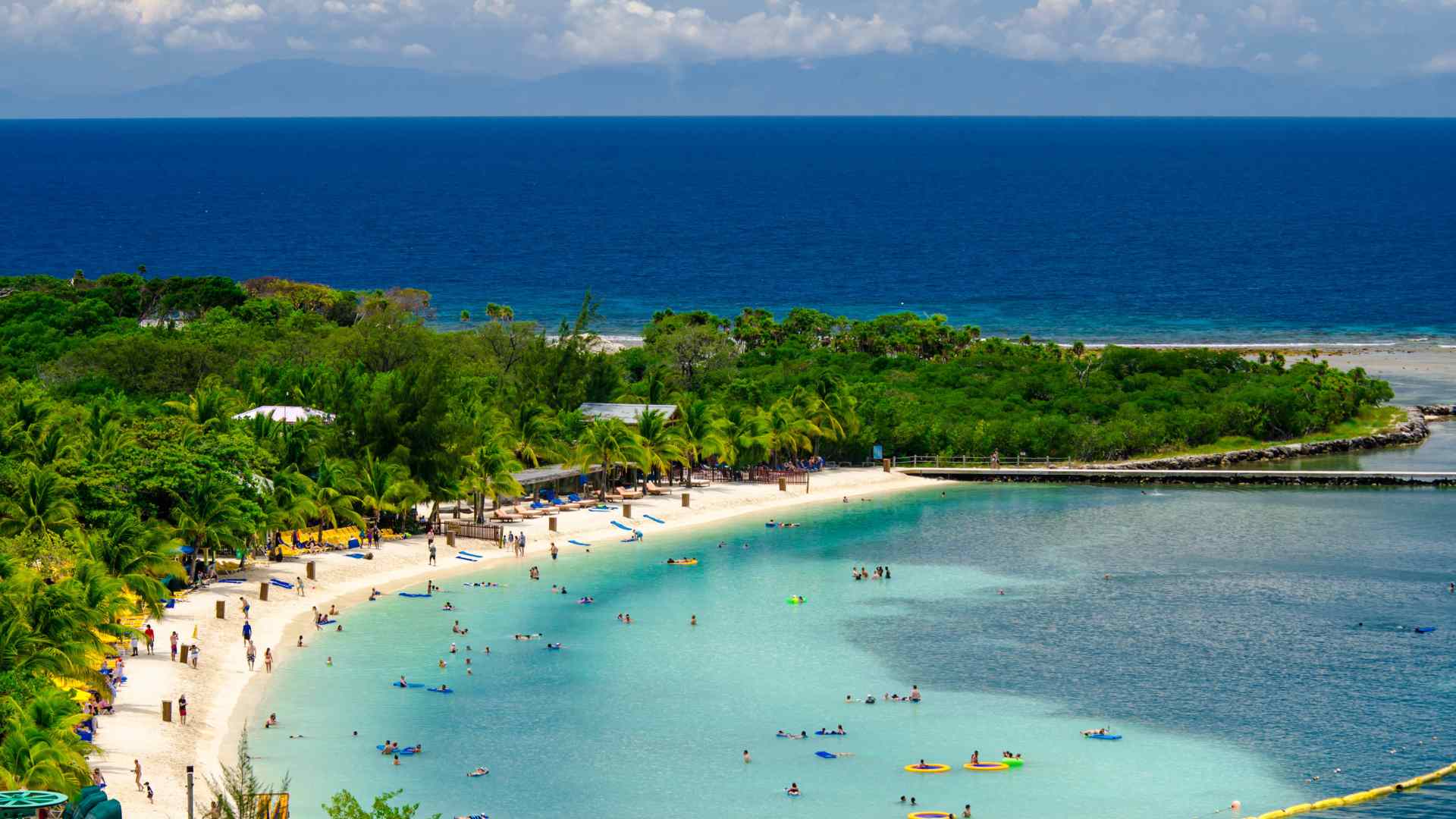 Curved white sand beach at Mahogany Bay, Roatan