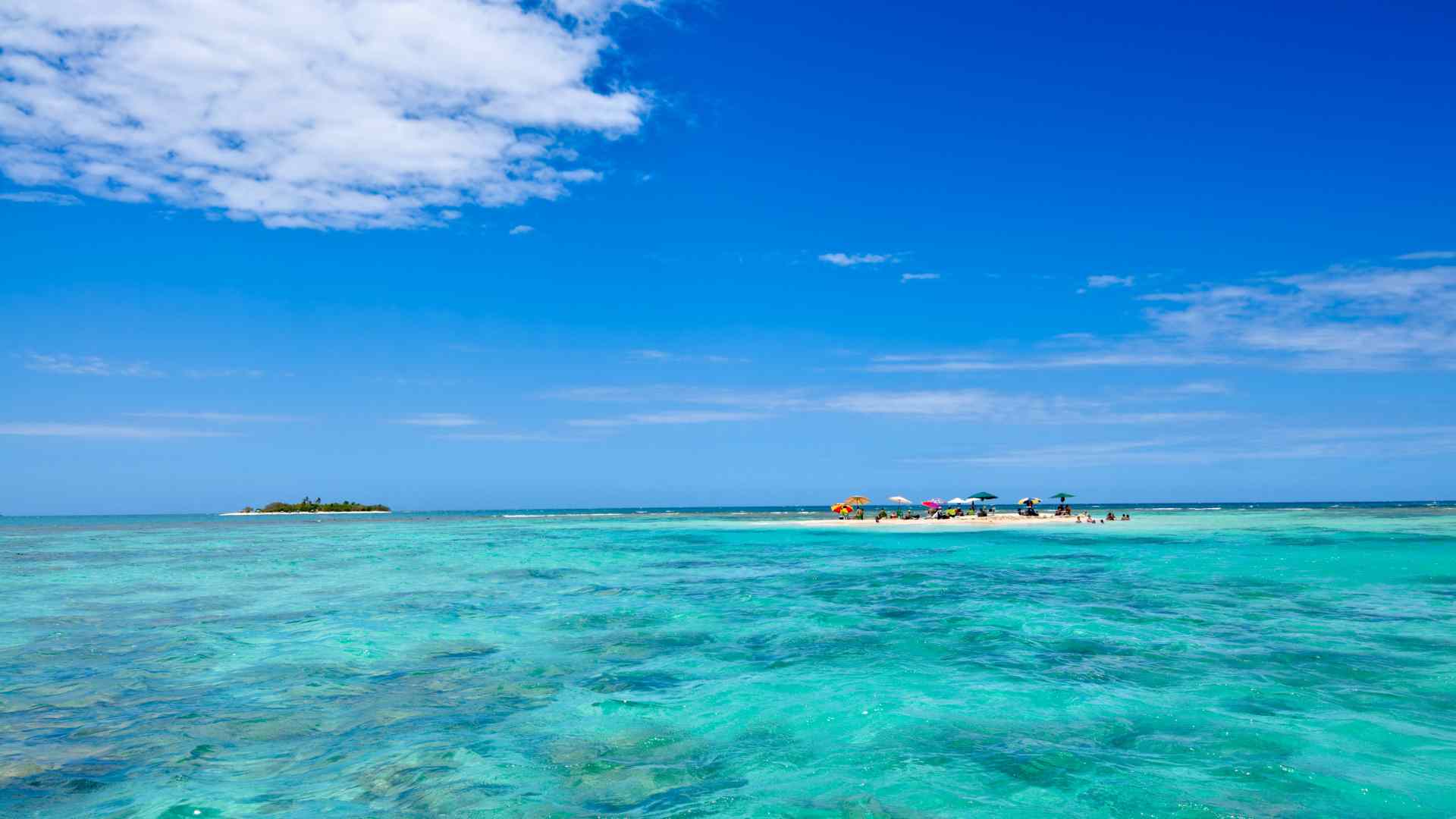 Clear turquoise water and distant island at Ocean Cay