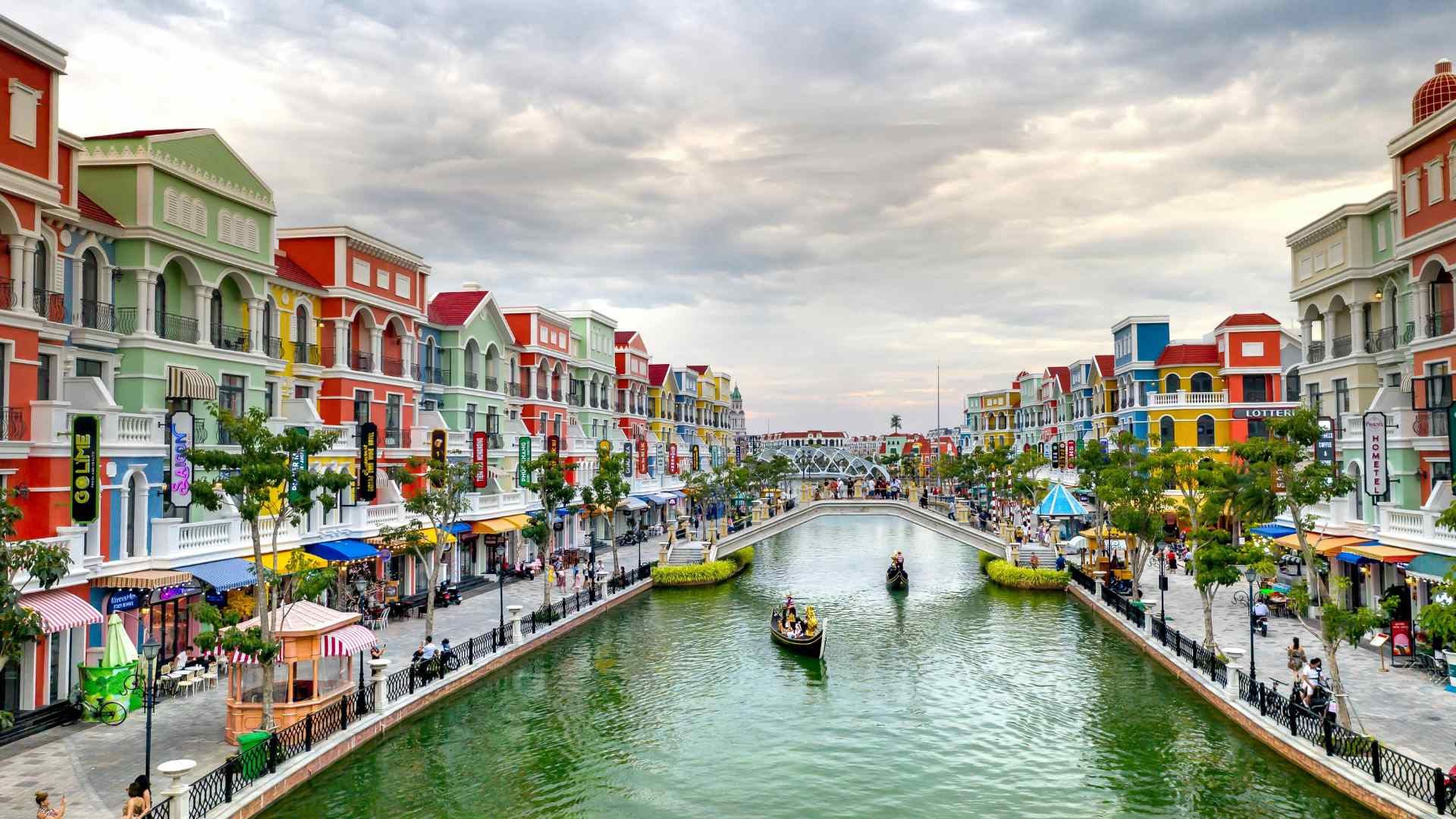 Pedestrian promenade along a colorful canal in Vietnam