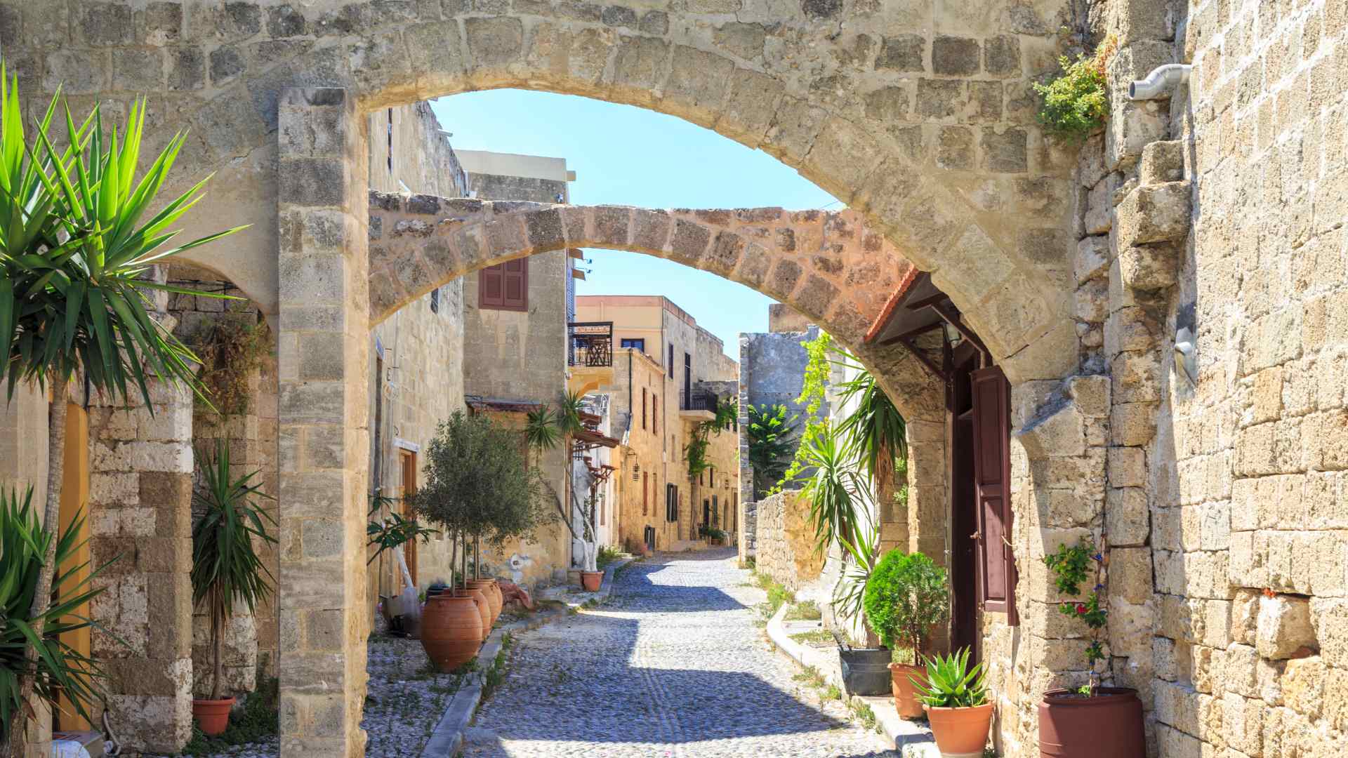 Medieval stone archway and lane in Rhodes Old Town