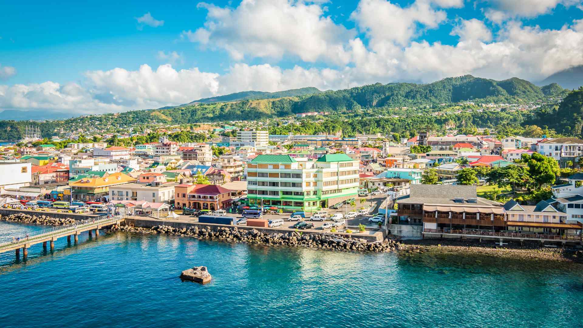 Roseau waterfront and green mountains on Dominica